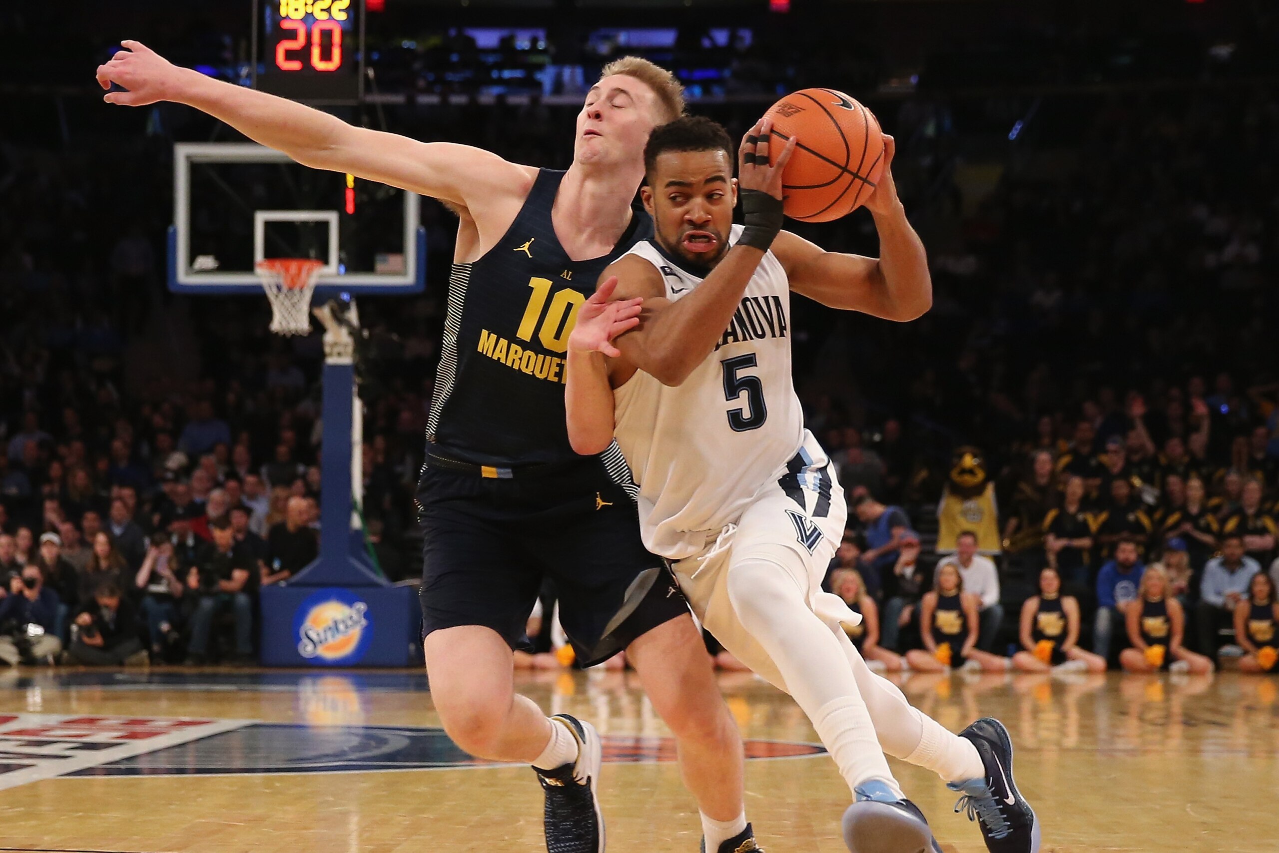 NEW YORK, NY - MARCH 08: Phil Booth #5 of the Villanova Wildcats drives past Sam Hauser #10 of the Marquette Golden Eagles in the second half during quarterfinals of the Big East Basketball Tournament at Madison Square Garden on March 8, 2018 in New York NEW YORK, NY - MARCH 08: Phil Booth #5 of the Villanova Wildcats drives past Sam Hauser #10 of the Marquette Golden Eagles in the second half during quarterfinals of the Big East Basketball Tournament at Madison Square Garden on March 8, 2018 in New York