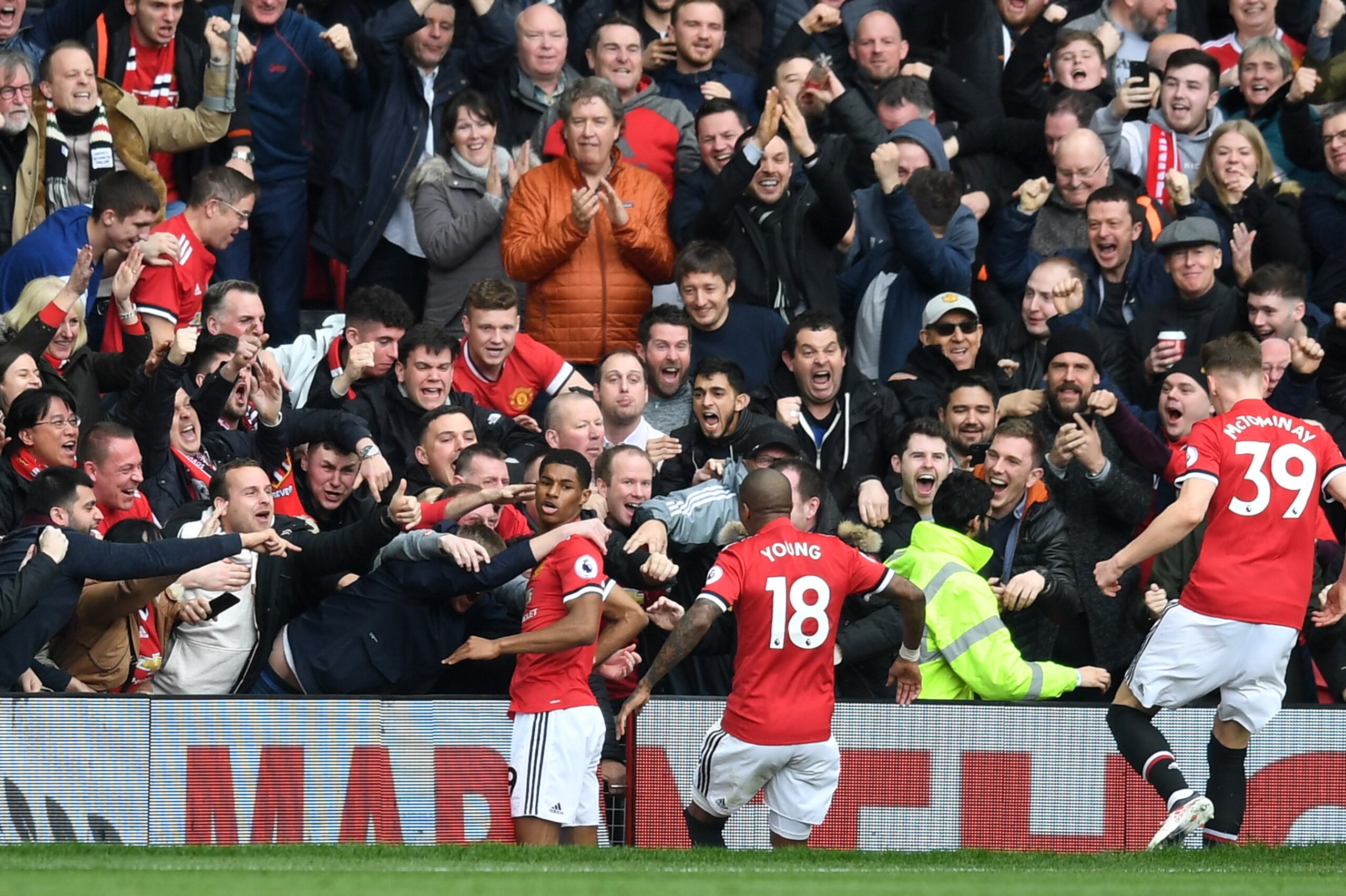 MANCHESTER, ENGLAND - MARCH 10:  Marcus Rashford of Manchester United celebrates scoring his side's first goal with fans and team mates during the Premier League match between Manchester United and Liverpool at Old Trafford on March 10, 2018 in Manchester