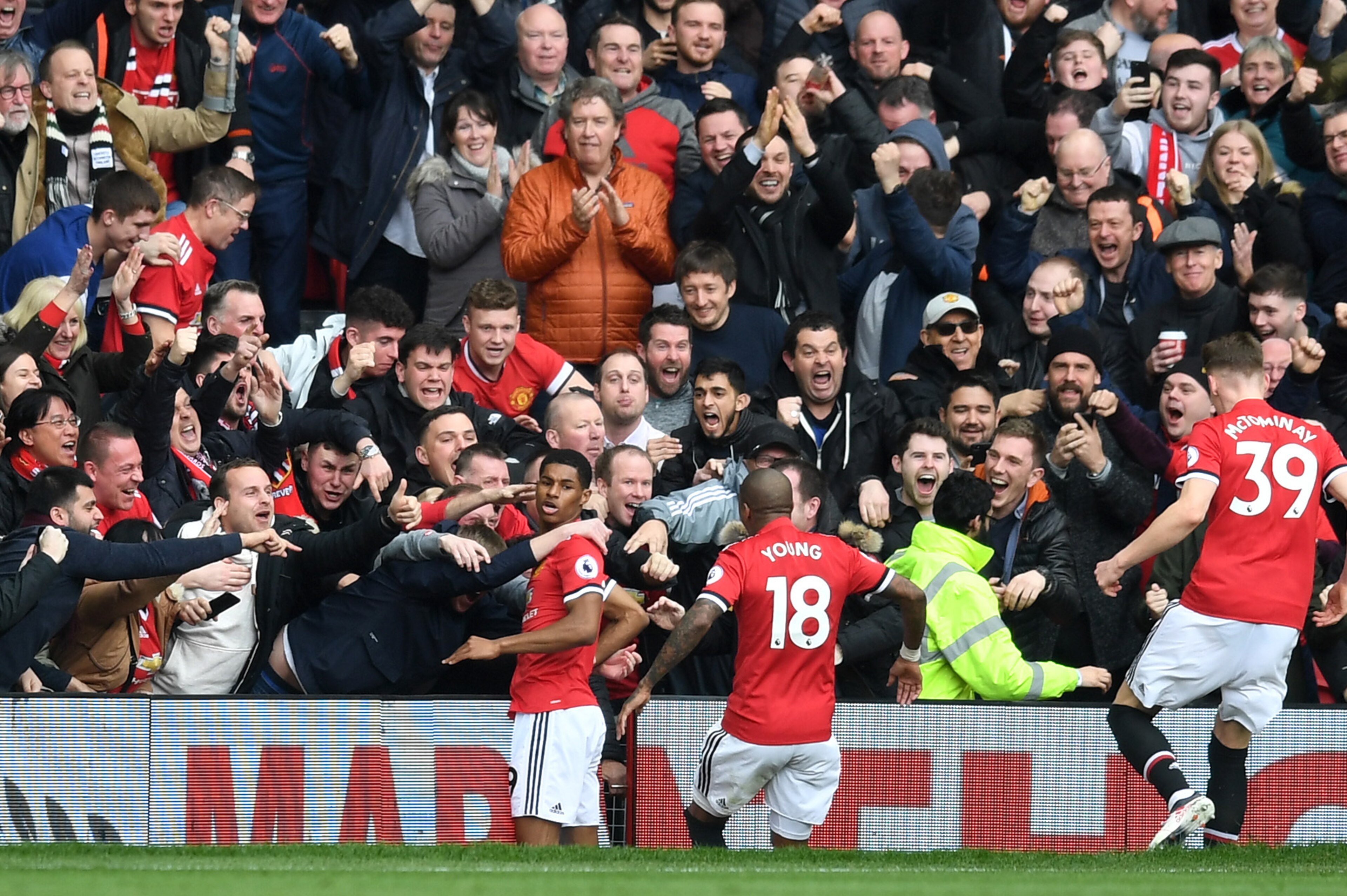 MANCHESTER, ENGLAND - MARCH 10:  Marcus Rashford of Manchester United celebrates scoring his side's first goal with fans and team mates during the Premier League match between Manchester United and Liverpool at Old Trafford on March 10, 2018 in Manchester
