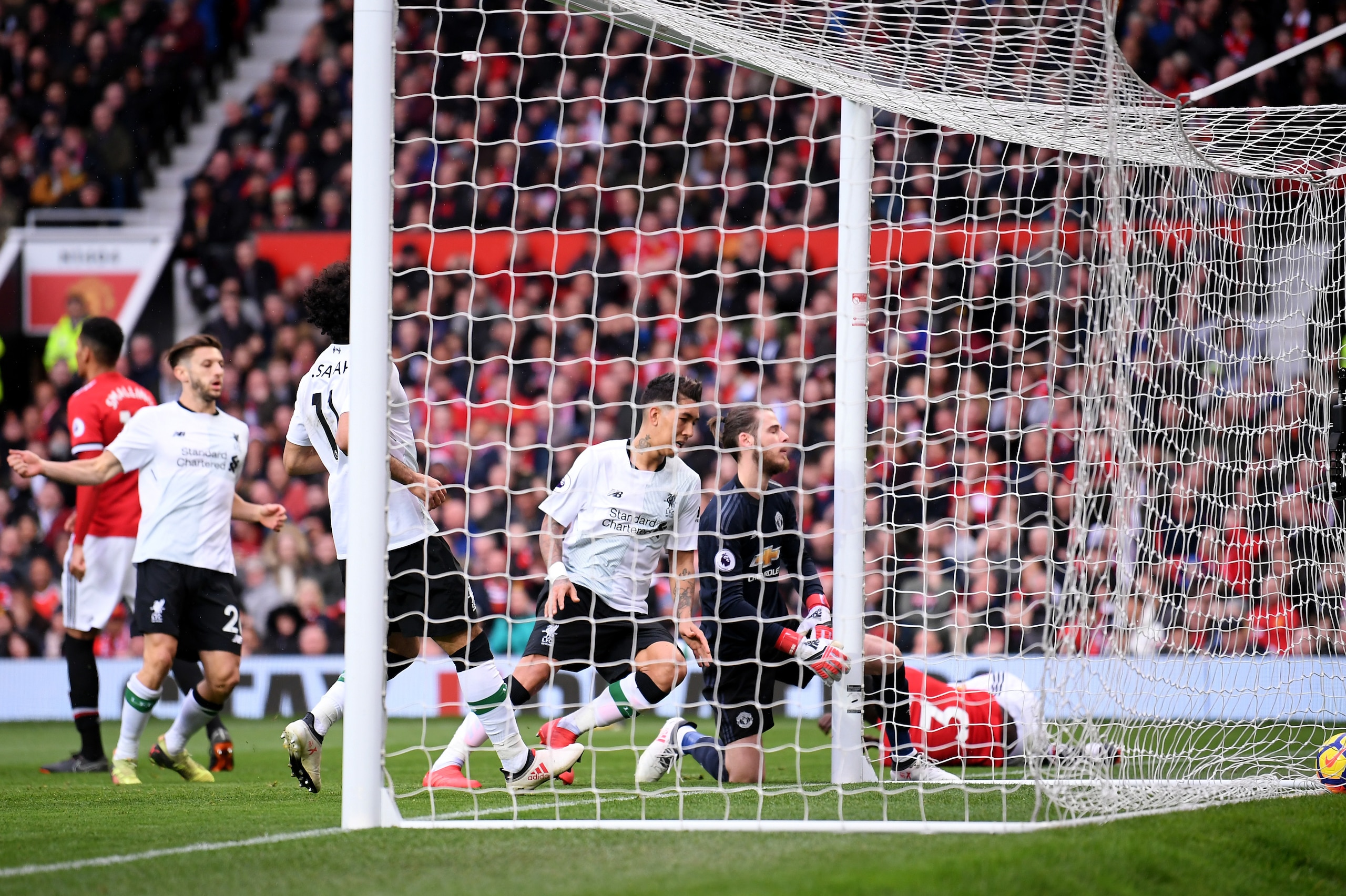 MANCHESTER, ENGLAND - MARCH 10:  Eric Bailly of Manchester United scores an own goal during the Premier League match between Manchester United and Liverpool at Old Trafford on March 10, 2018 in Manchester, England.  (Photo by Laurence Griffiths/Getty Imag