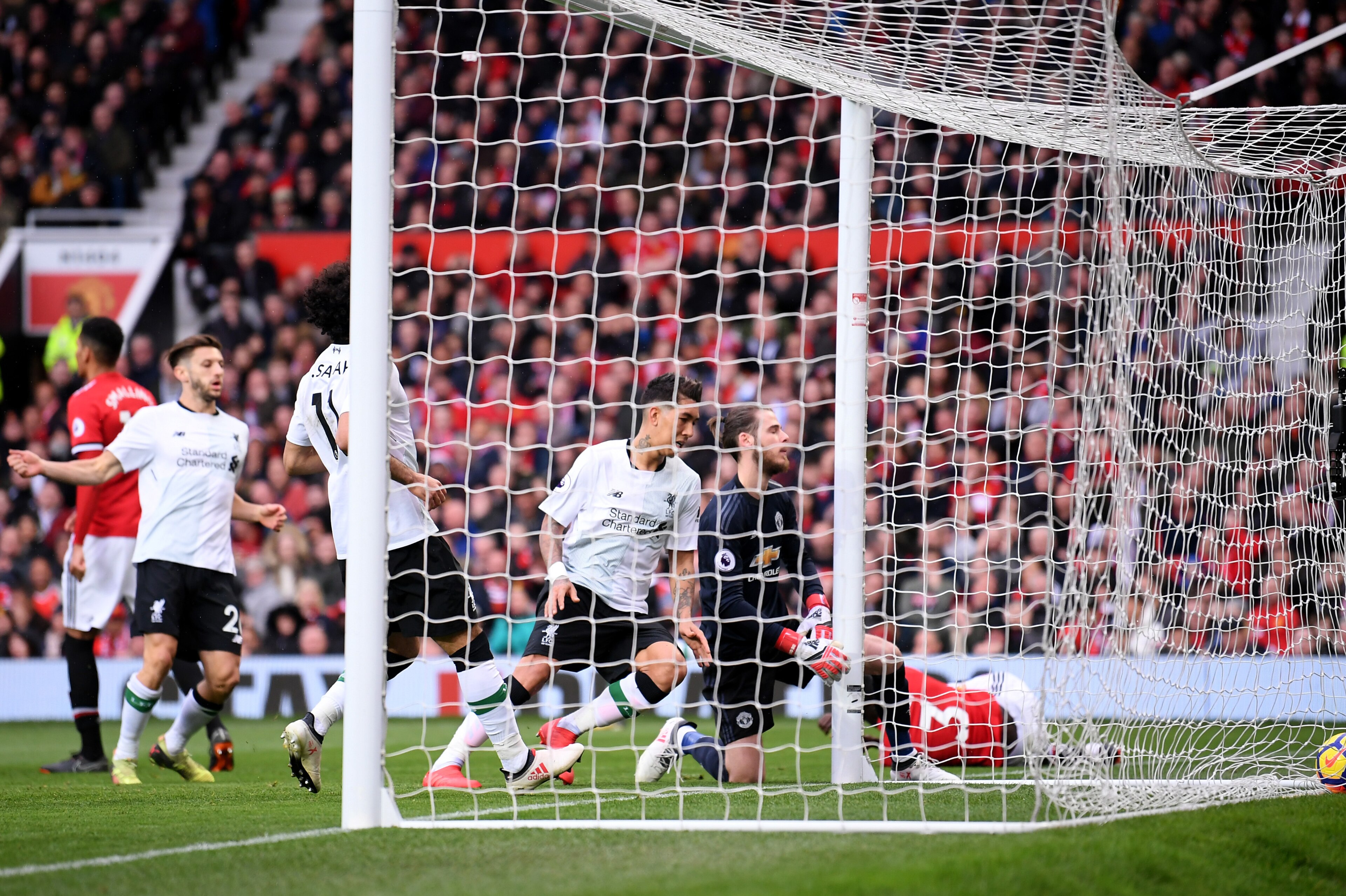 MANCHESTER, ENGLAND - MARCH 10:  Eric Bailly of Manchester United scores an own goal during the Premier League match between Manchester United and Liverpool at Old Trafford on March 10, 2018 in Manchester, England.  (Photo by Laurence Griffiths/Getty Imag