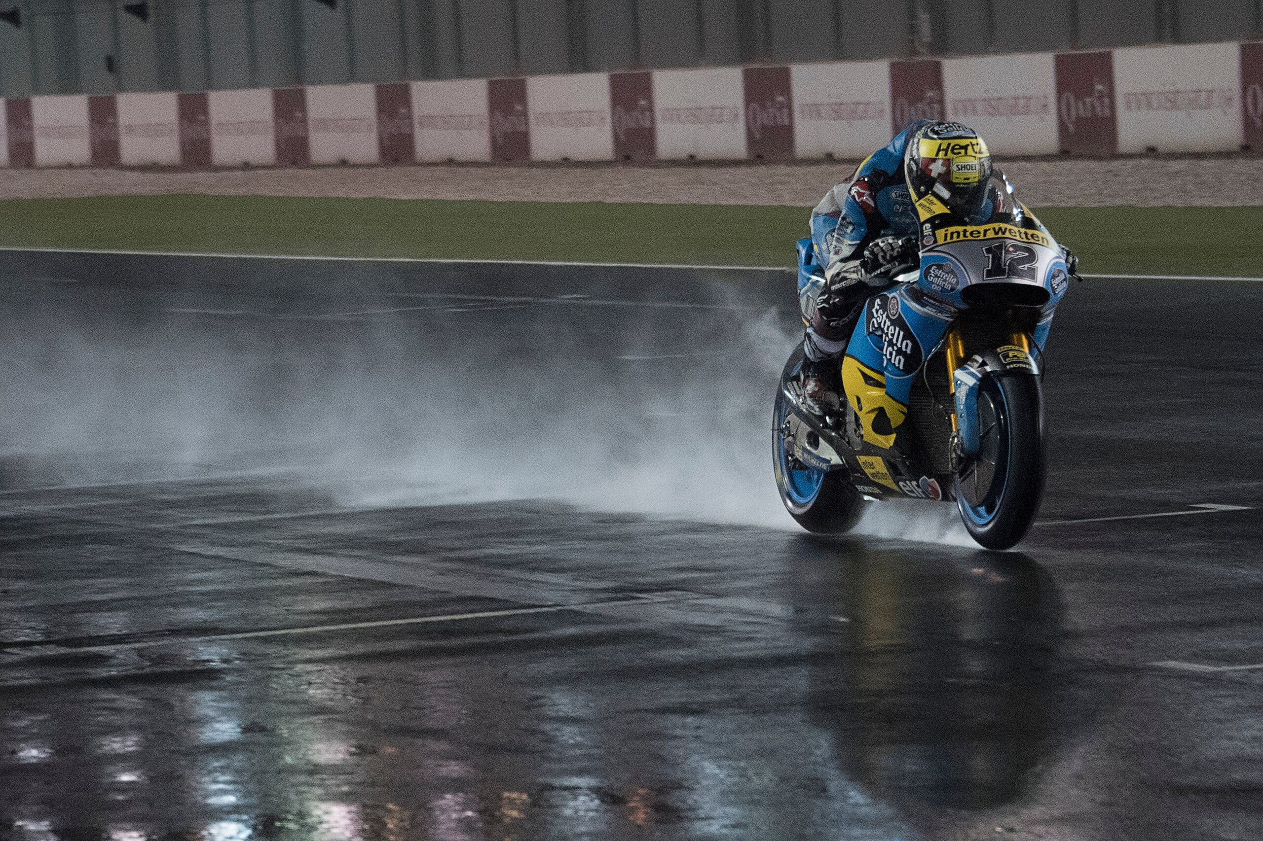 DOHA, QATAR - MARCH 03:  Tom Luthi of Switzerland and and Team EG 0,0 Marc VDS heads down a straight and test the wet track during the Moto GP Testing - Qatar at Losail Circuit on March 3, 2018 in Doha, Qatar.  (Photo by Mirco Lazzari gp/Getty Images)