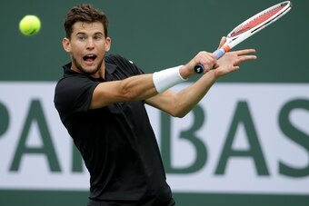 INDIAN WELLS, CA - MARCH 10:  Dominic Thiem of Austria returns a backhand to Stefanos Tsitsipas of Greece during the BNP Paribas Open on March 10, 2018 at the Indian Wells Tennis Garden in Indian Wells, California.  (Photo by Jeff Gross/Getty Images)
