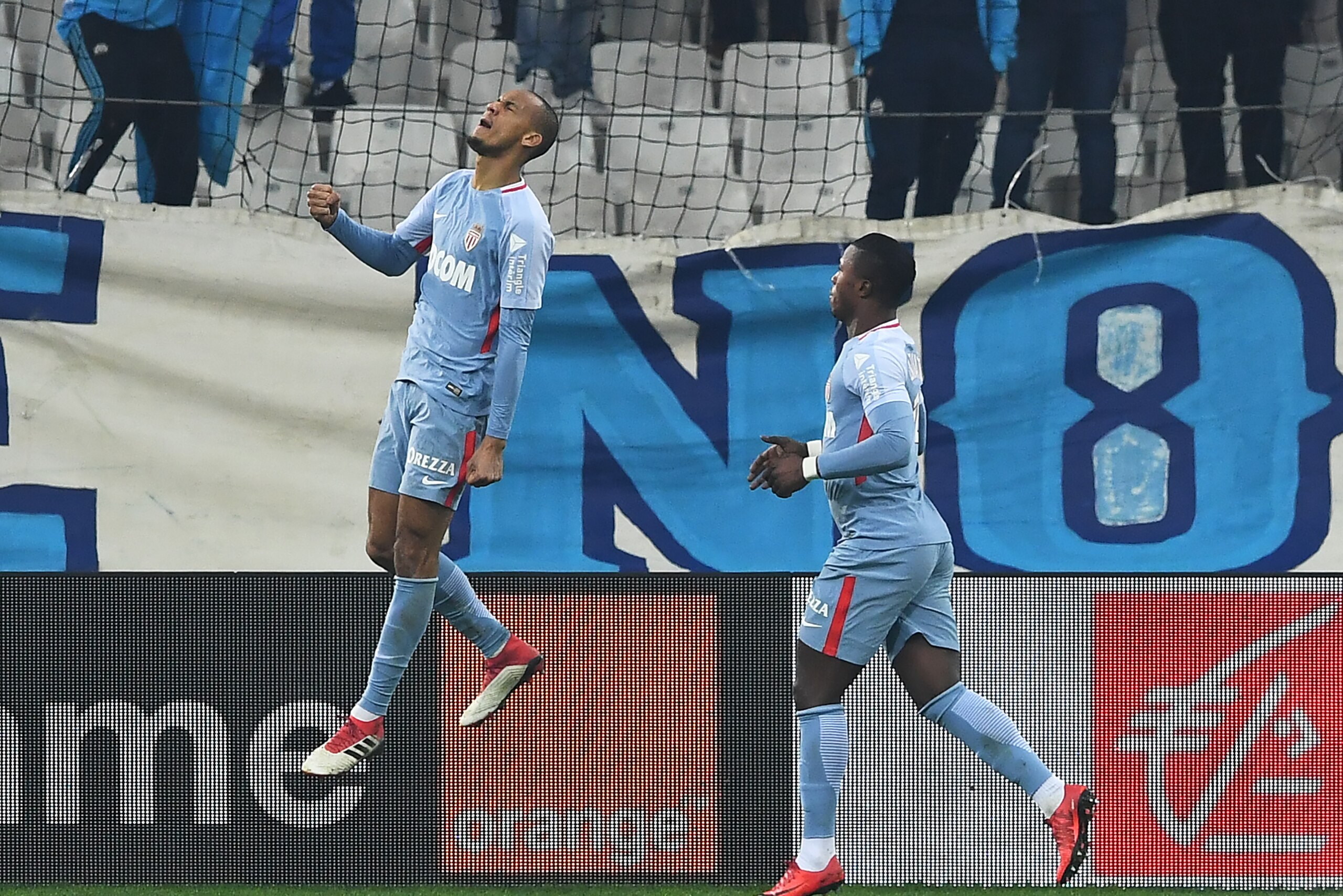 Monaco's Brazilian defender Fabinho (L) celebrates after scoring a goal during the French L1 football match Marseille vs Monaco, on January 28, 2018 at the Velodrome stadium in Marseille, southern France.  / AFP PHOTO / ANNE-CHRISTINE POUJOULAT        (Ph