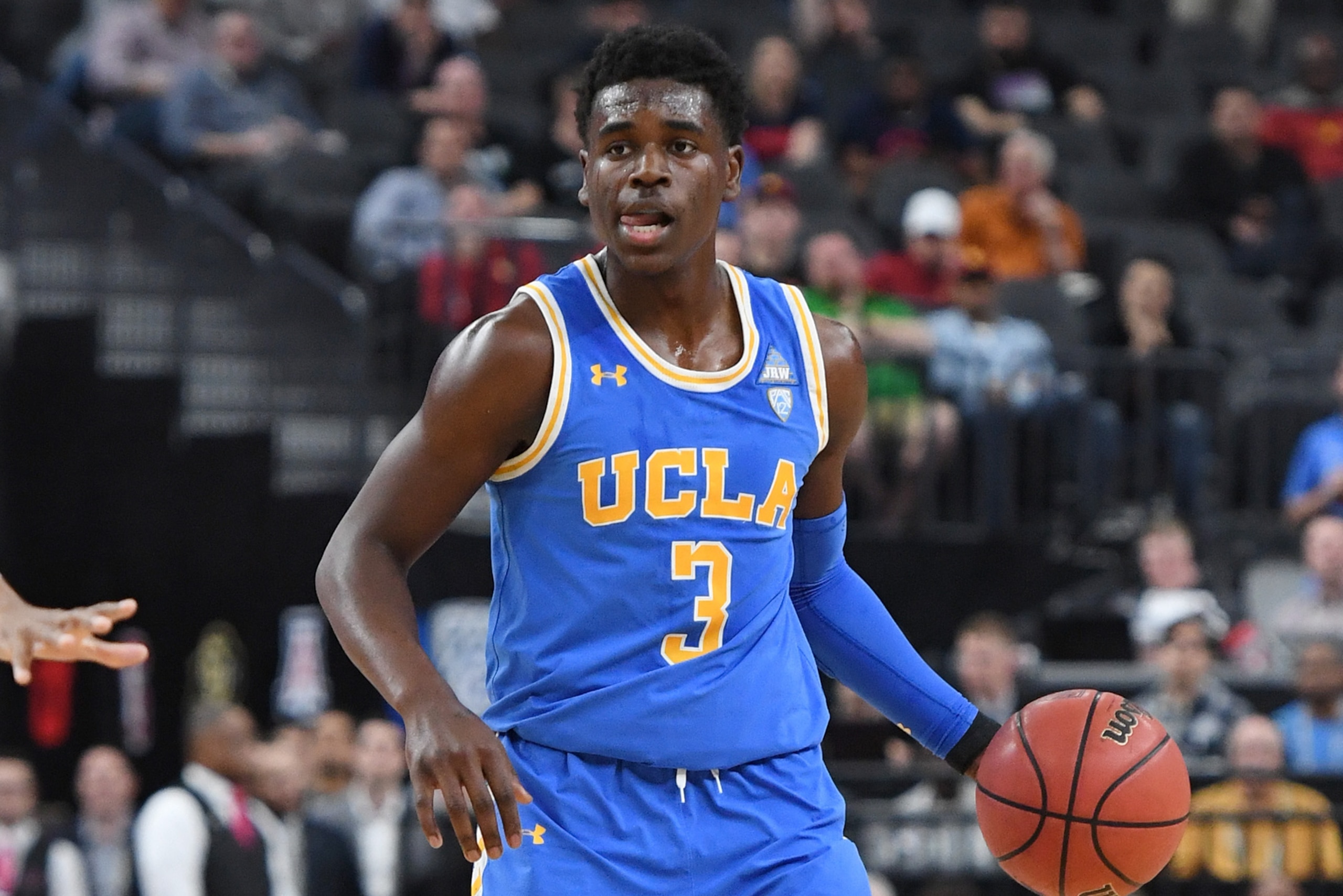 LAS VEGAS, NV - MARCH 09:  Aaron Holiday #3 of the UCLA Bruins brings the ball up the court against the Arizona Wildcats during a semifinal game of the Pac-12 basketball tournament at T-Mobile Arena on March 9, 2018 in Las Vegas, Nevada.  (Photo by Ethan 