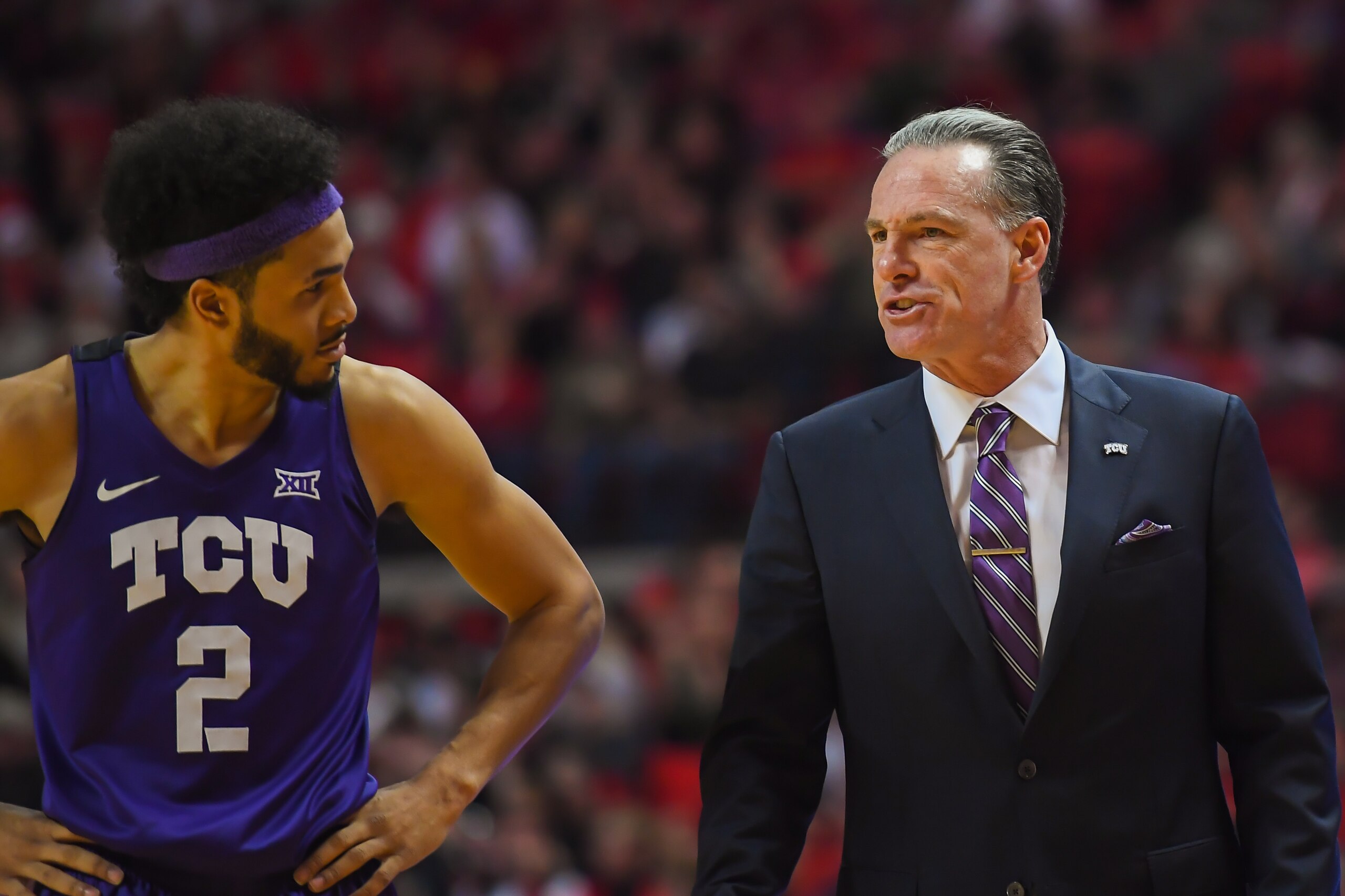 LUBBOCK, TX - MARCH 3: Head coach Jamie Dixon talks with Shawn Olden #2 of the TCU Horned Frogs during the game against the Texas Tech Red Raiders on March 3, 2018 at United Supermarket Arena in Lubbock, Texas. Texas Tech defeated TCU 79-75. Texas Tech de