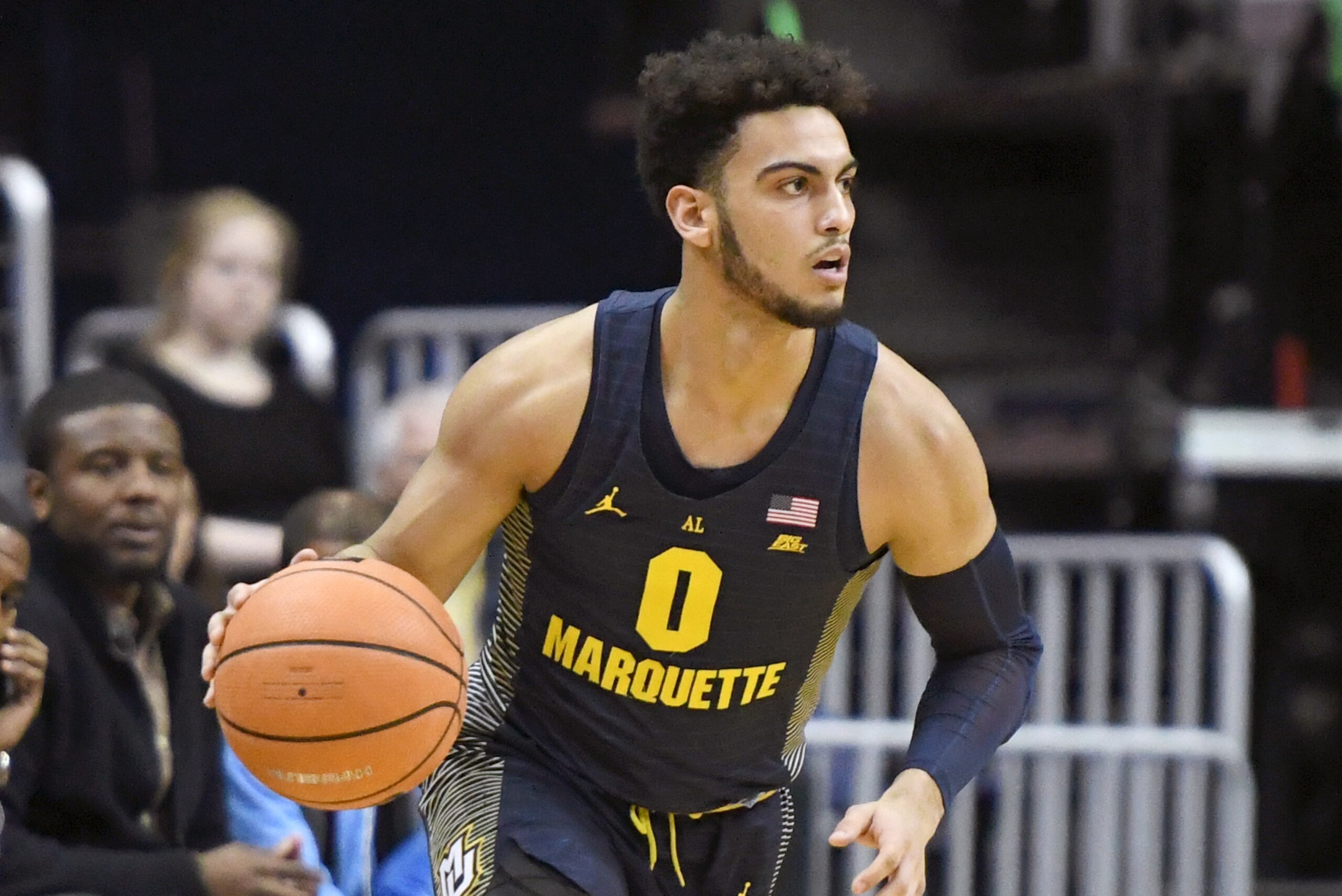 WASHINGTON, DC - FEBRUARY 26:  Markus Howard #0 of the Marquette Golden Eagles dribbles the ball during a college basketball game against the Georgetown Hoyas at the Capital One Arena on February 26, 2018 in Washington, DC.  The Golden Eagles won 90-86.  