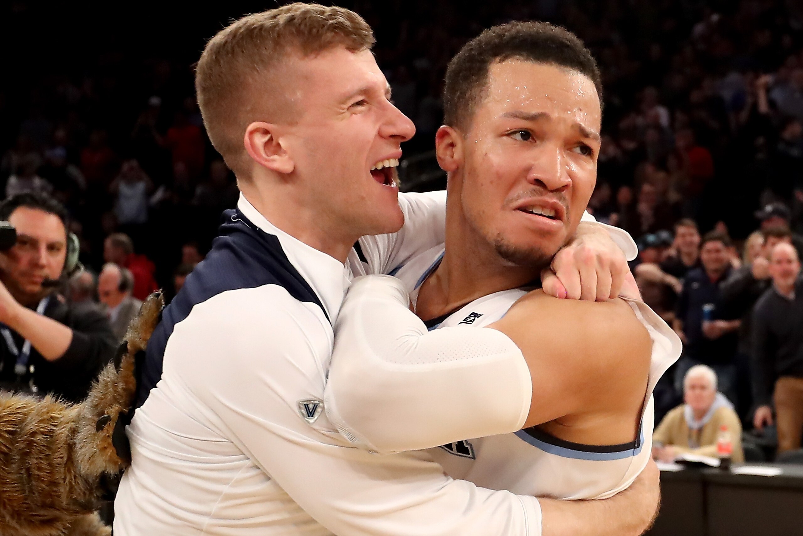 NEW YORK, NY - MARCH 10:  Denny Grace #40 and Jalen Brunson #1 of the Villanova Wildcats celebrate the overtime win during the championship game of the Big East Basketball Tournament at Madison Square Garden on March 10, 2018 in New York City.  (Photo by 