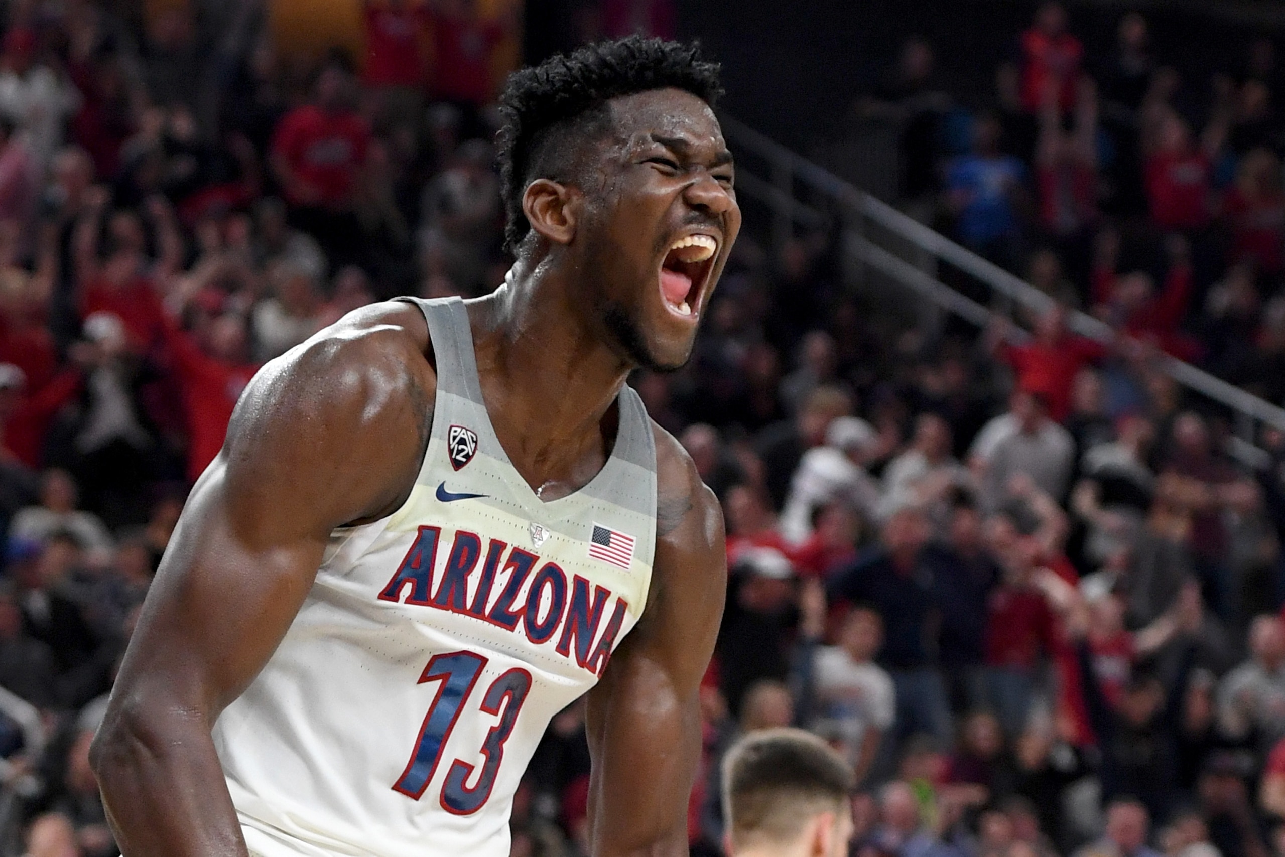 LAS VEGAS, NV - MARCH 10:  Deandre Ayton #13 of the Arizona Wildcats reacts after dunking against the USC Trojans during the championship game of the Pac-12 basketball tournament at T-Mobile Arena on March 10, 2018 in Las Vegas, Nevada. The Wildcats won 7
