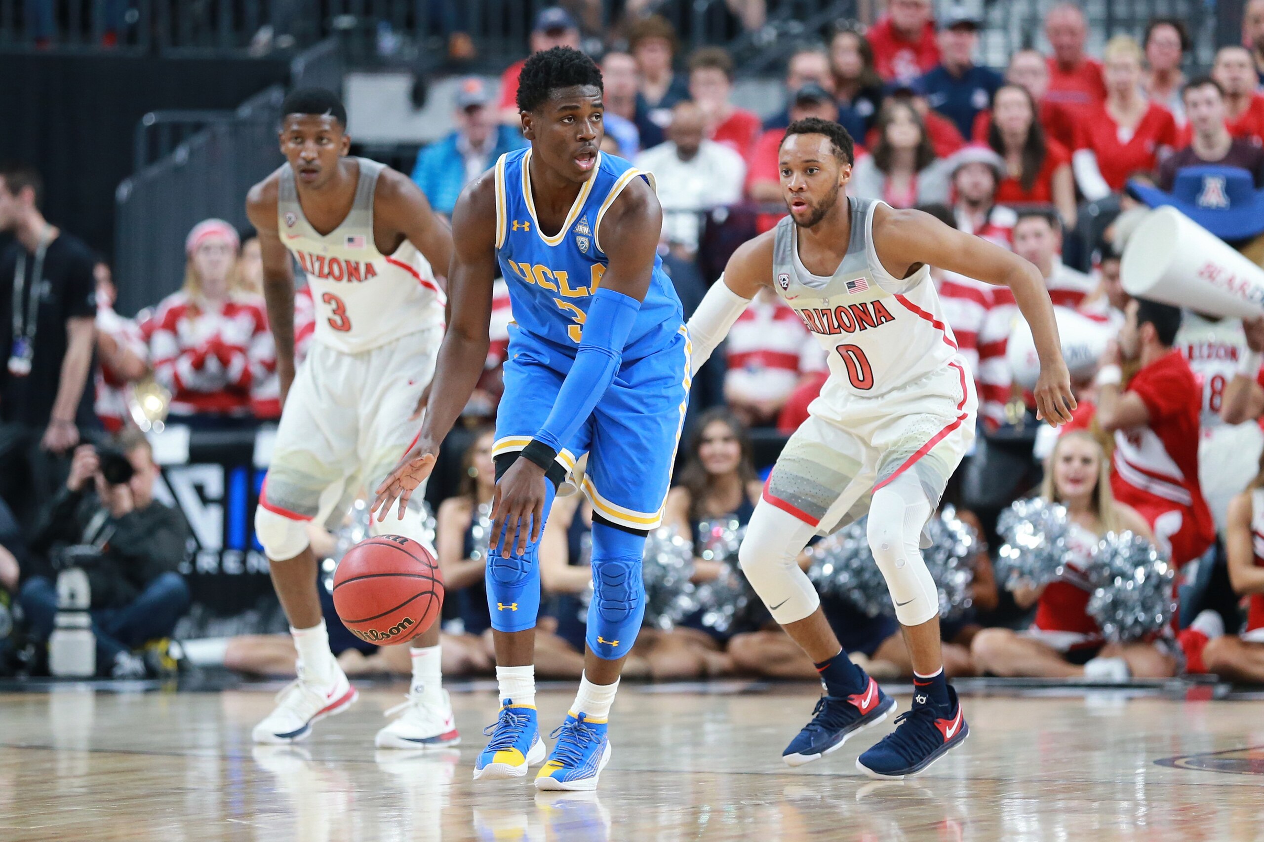 LAS VEGAS, NV - MARCH 09: Aaron Holiday #3 of the UCLA Bruins handles the ball against Parker Jackson-Cartwright #0 of the Arizona Wildcats during a semifinal game of the Pac-12 basketball tournament at T-Mobile Arena on March 9, 2018 in Las Vegas, Nevada LAS VEGAS, NV - MARCH 09: Aaron Holiday #3 of the UCLA Bruins handles the ball against Parker Jackson-Cartwright #0 of the Arizona Wildcats during a semifinal game of the Pac-12 basketball tournament at T-Mobile Arena on March 9, 2018 in Las Vegas, Nevada