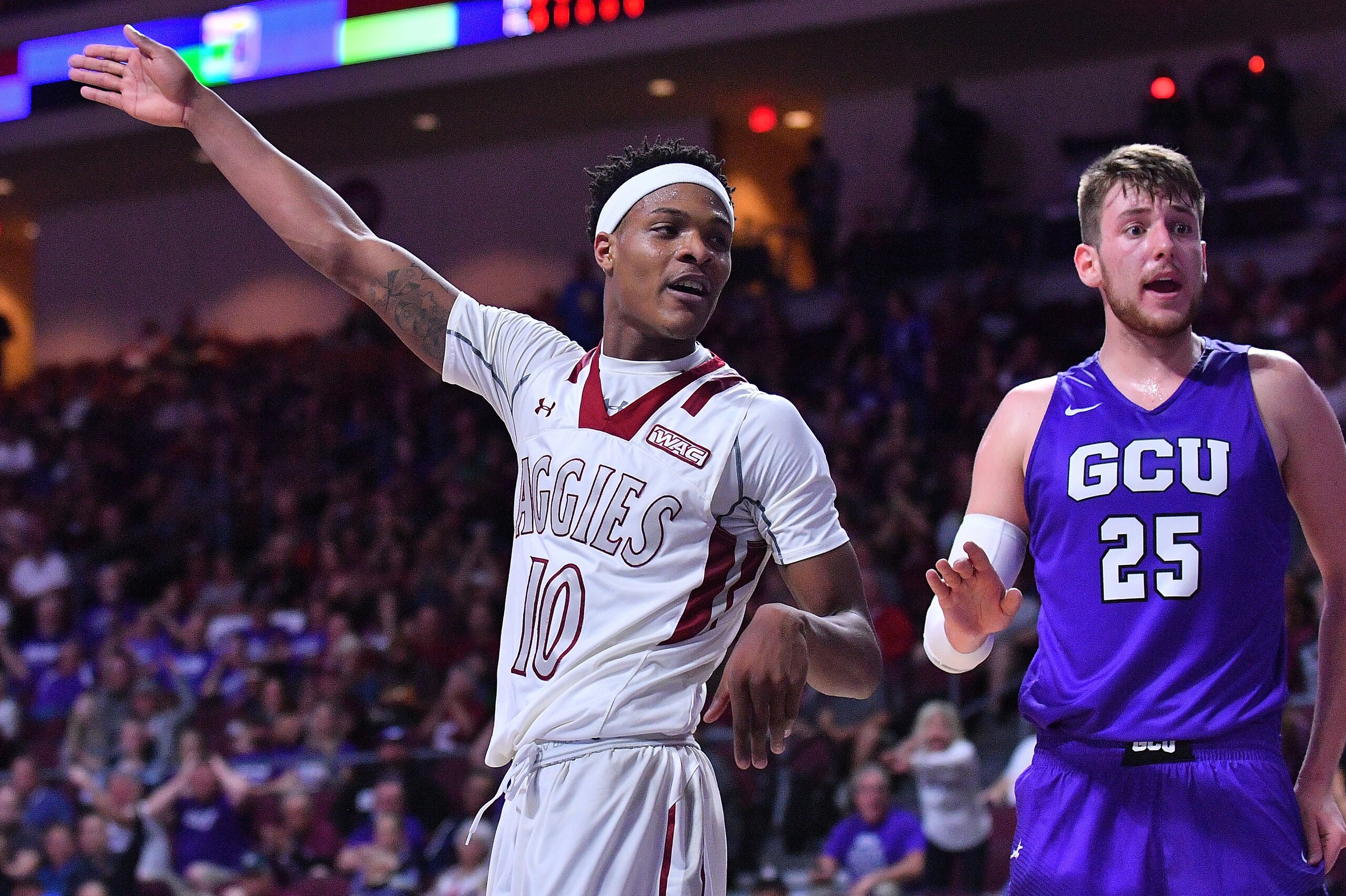 LAS VEGAS, NV - MARCH 10: Jemerrio Jones #10 of the New Mexico State Aggies signals for possession of the ball as Allesandro Lever #25 of the Grand Canyon Lopes looks on during the championship game of the Western Athletic Conference basketball tournamen LAS VEGAS, NV - MARCH 10: Jemerrio Jones #10 of the New Mexico State Aggies signals for possession of the ball as Allesandro Lever #25 of the Grand Canyon Lopes looks on during the championship game of the Western Athletic Conference basketball tournamen