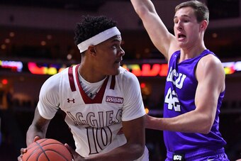 LAS VEGAS, NV - MARCH 10:  Jemerrio Jones #10 of the New Mexico State Aggies posts up against Gerard Martin #42 of the Grand Canyon Lopes during the championship game of the Western Athletic Conference basketball tournament at the Orleans Arena on March 1