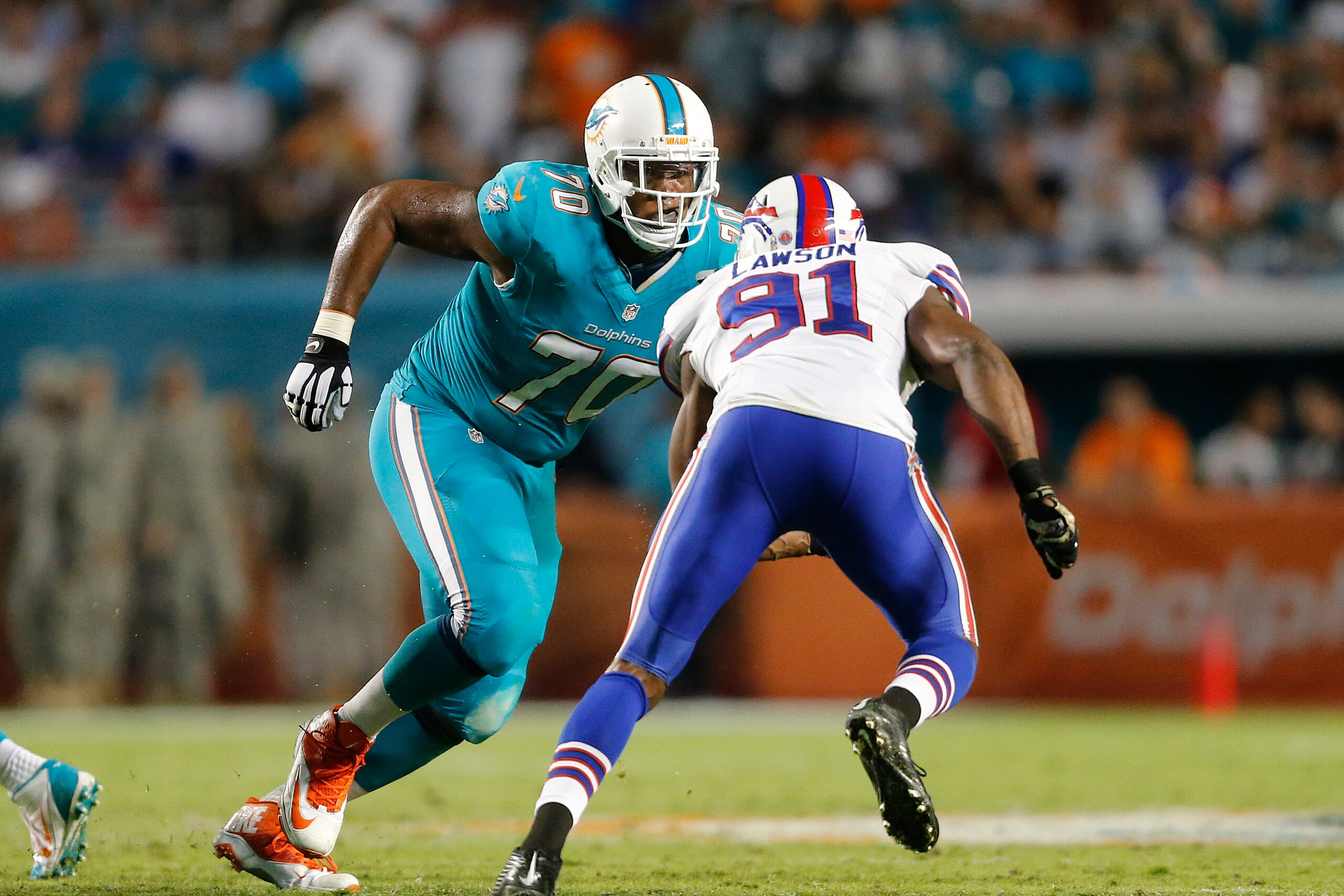 MIAMI GARDENS, FL - NOVEMBER 13: Ja'Wuan James #70 of the Miami Dolphins defends against Manny Lawson #91 of the Buffalo Bills on November 13, 2014 at Sun Life Stadium in Miami Gardens, Florida. The Dolphins defeated the Bills 22-9. (Photo by Joel Auerbac MIAMI GARDENS, FL - NOVEMBER 13: Ja'Wuan James #70 of the Miami Dolphins defends against Manny Lawson #91 of the Buffalo Bills on November 13, 2014 at Sun Life Stadium in Miami Gardens, Florida. The Dolphins defeated the Bills 22-9. (Photo by Joel Auerbac