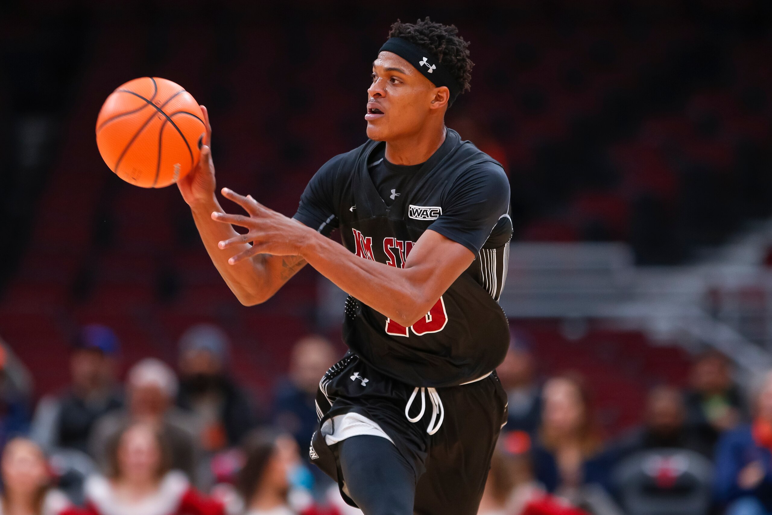 CHAMPAIGN, IL - DECEMBER 16: Jemerrio Jones #10 of the New Mexico State Aggies passes the ball off during the game against the Illinois Fighting Illini at United  Center on December 16, 2017 in Chicago, Illinois. (Photo by Michael Hickey/Getty Images)