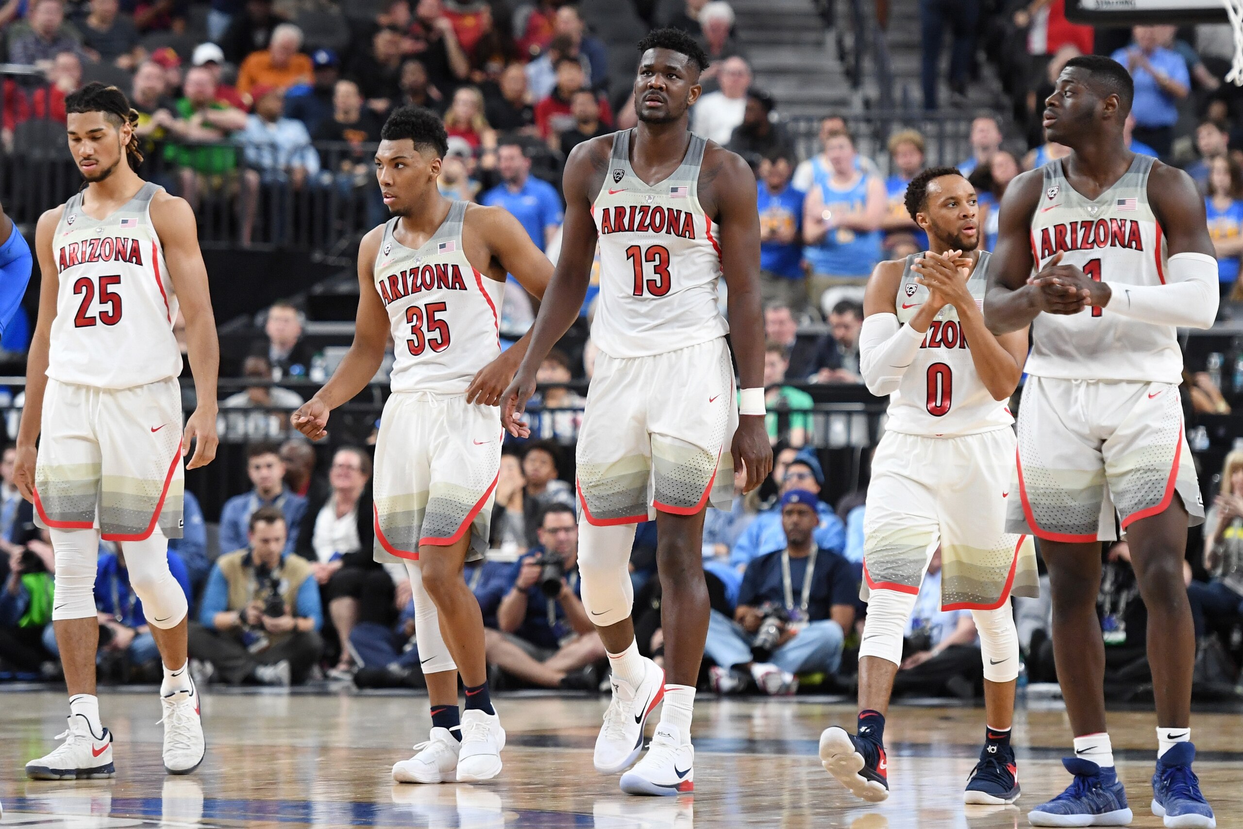 LAS VEGAS, NV - MARCH 09:  Keanu Pinder #25, Allonzo Trier #35, Deandre Ayton #13, Parker Jackson-Cartwright #0 and Rawle Alkins #1 of the Arizona Wildcats walk on the court during a semifinal game of the Pac-12 basketball tournament against the UCLA Brui