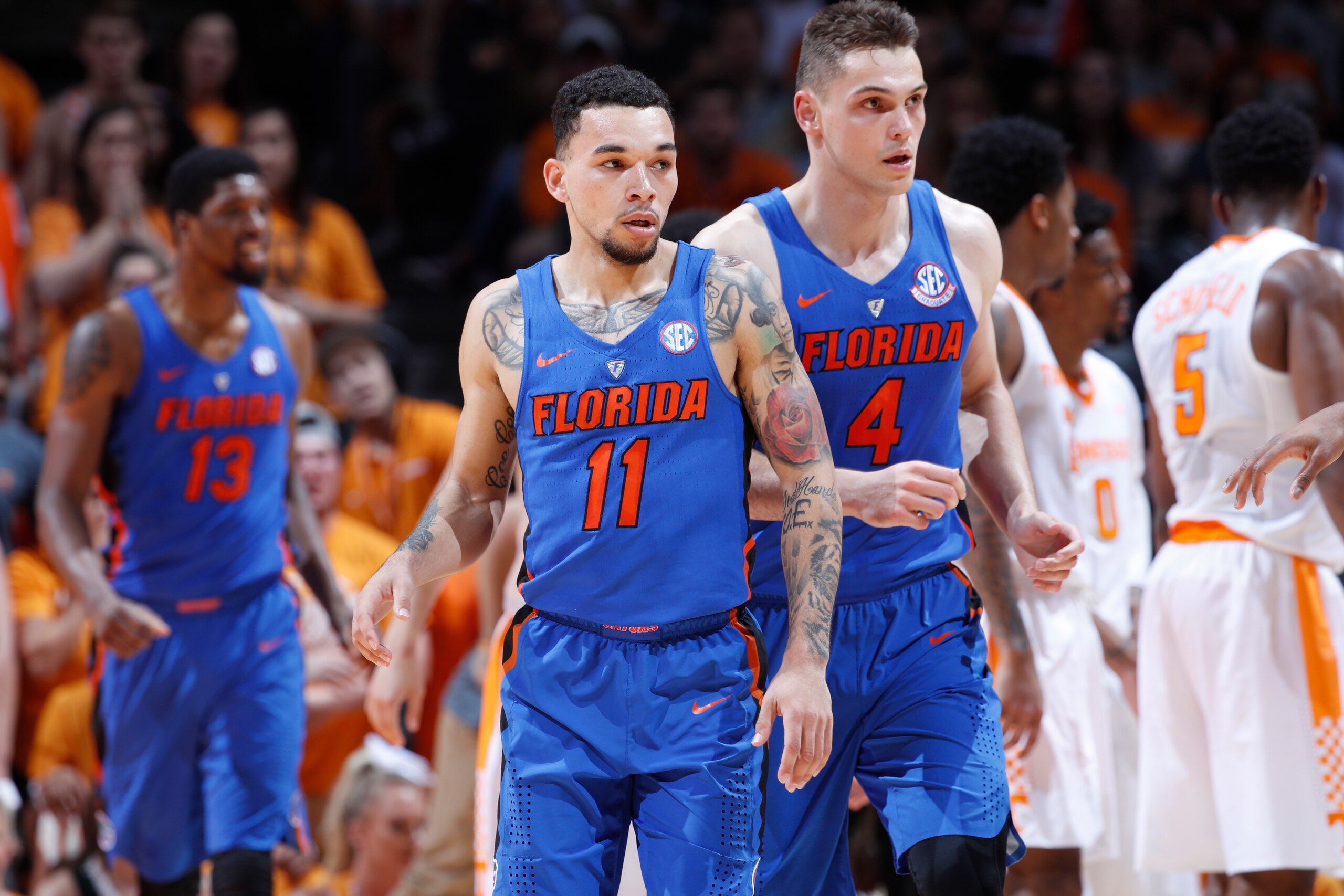 KNOXVILLE, TN - FEBRUARY 21: Chris Chiozza #11 and Egor Koulechov #4 of the Florida Gators look on during a game against the Tennessee Volunteers at Thompson-Boling Arena on February 21, 2018 in Knoxville, Tennessee. Tennessee won 62-57. (Photo by Joe Rob