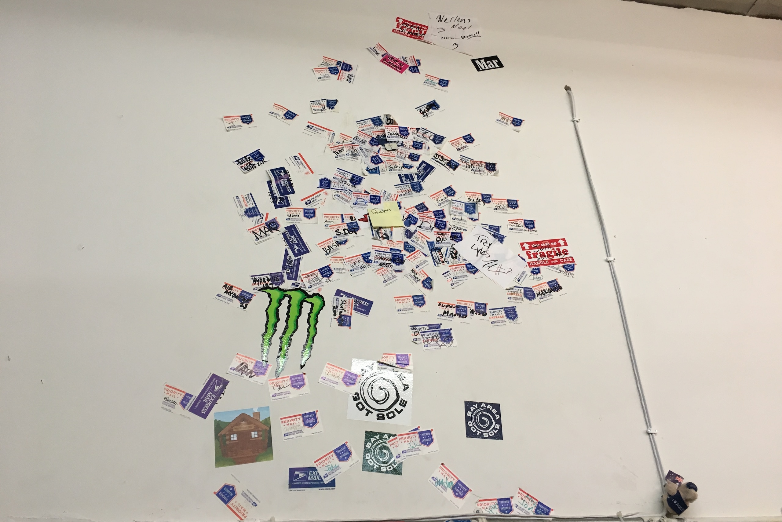 The wall at Project Blitz covered with shipping stickers placed by players showing off their vertical jumps. The wall at Project Blitz covered with shipping stickers placed by players showing off their vertical jumps.