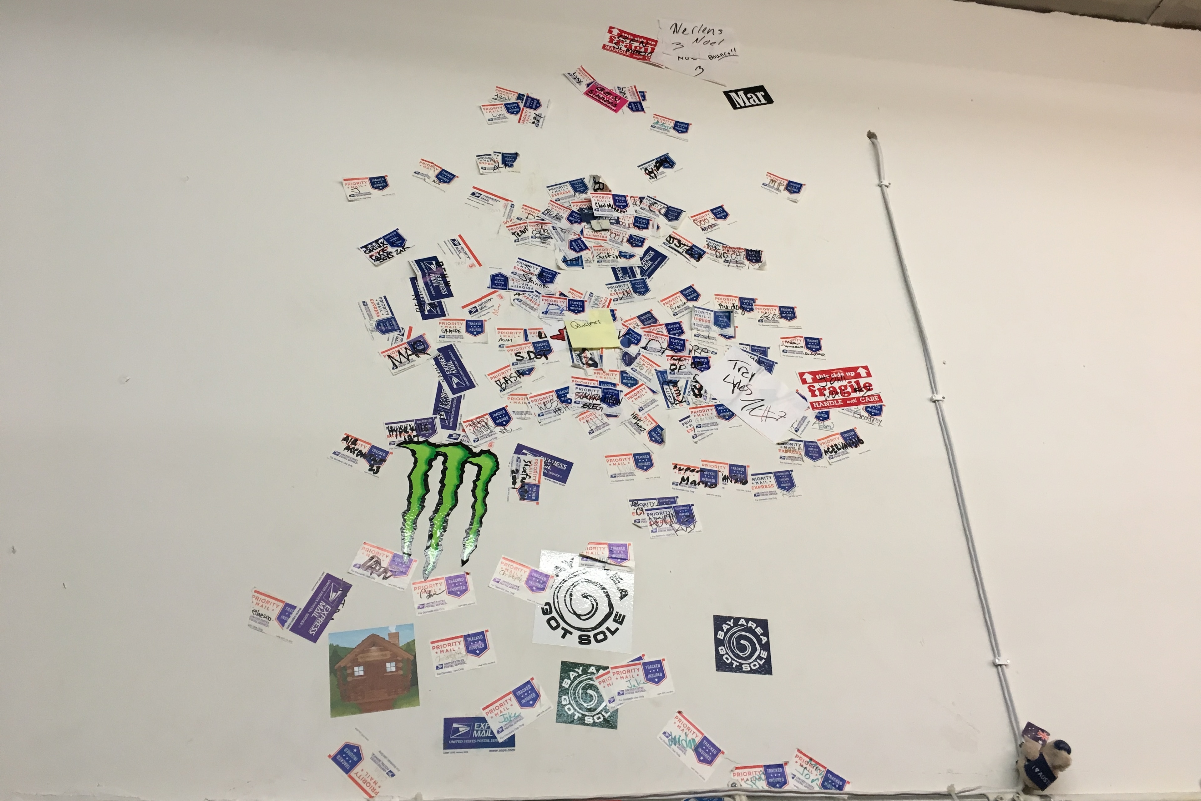 The wall at Project Blitz covered with shipping stickers placed by players showing off their vertical jumps. The wall at Project Blitz covered with shipping stickers placed by players showing off their vertical jumps.