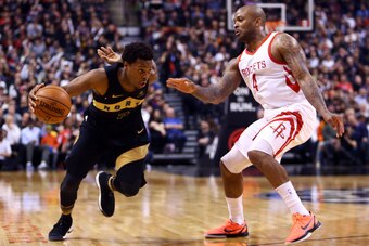 TORONTO, ON - MARCH 9:  Kyle Lowry #7 of the Toronto Raptors dribbles the ball as P.J. Tucker #4 of the Houston Rockets defends during the second half of an NBA game at Air Canada Centre on March 9, 2018 in Toronto, Canada.  NOTE TO USER: User expressly a