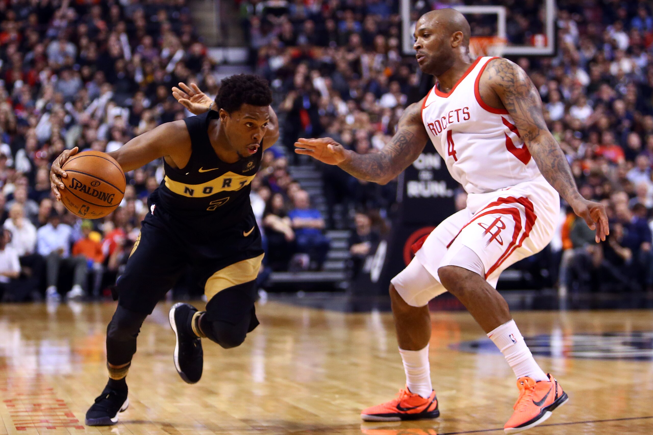 TORONTO, ON - MARCH 9: Kyle Lowry #7 of the Toronto Raptors dribbles the ball as P.J. Tucker #4 of the Houston Rockets defends during the second half of an NBA game at Air Canada Centre on March 9, 2018 in Toronto, Canada. NOTE TO USER: User expressly a TORONTO, ON - MARCH 9: Kyle Lowry #7 of the Toronto Raptors dribbles the ball as P.J. Tucker #4 of the Houston Rockets defends during the second half of an NBA game at Air Canada Centre on March 9, 2018 in Toronto, Canada. NOTE TO USER: User expressly a