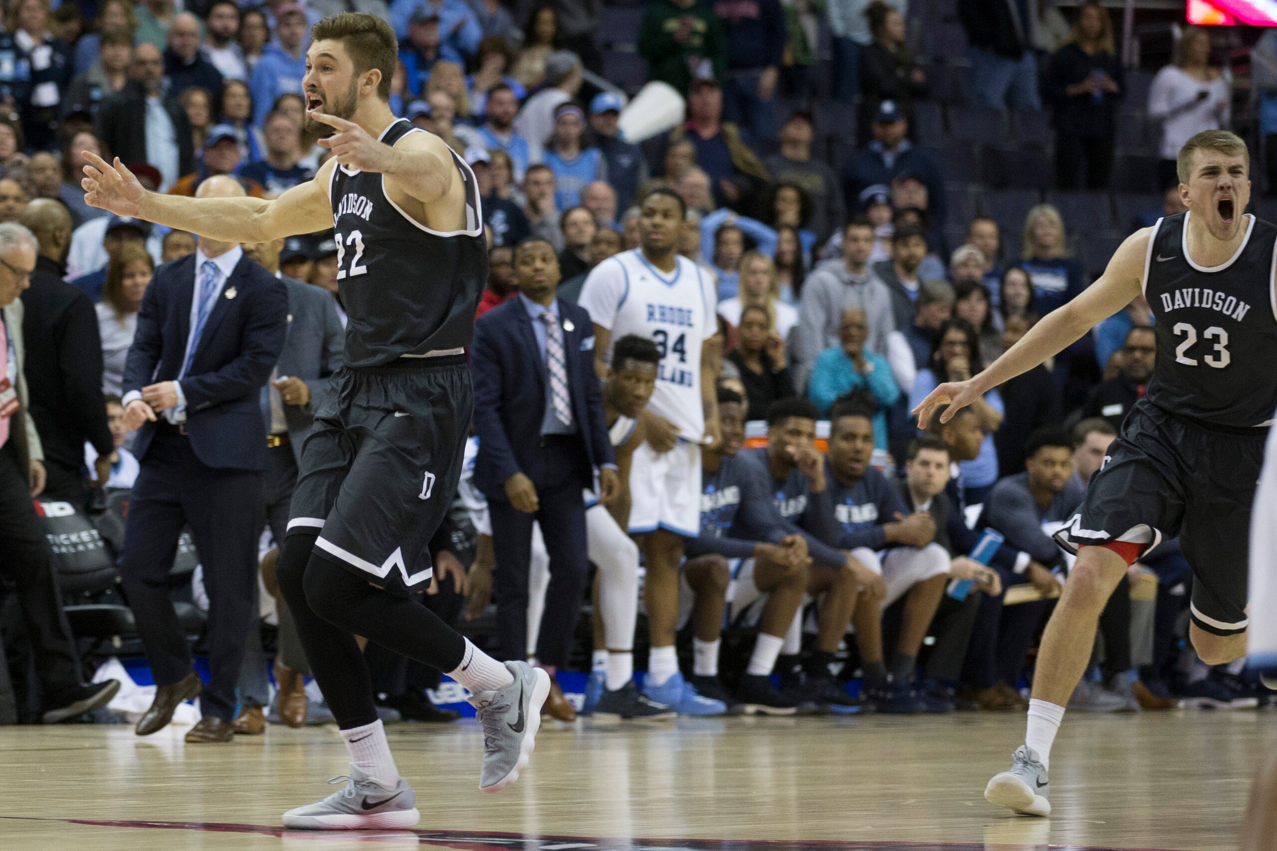 WASHINGTON, DC - MARCH 11: Peyton Aldridge #23 and Will Magarity #22 of the Davidson Wildcats celebrate after defeating the Rhode Island Rams in the Championship game of the Atlantic 10 Basketball tournament at Capital One Arena on March 11, 2018 in Washi