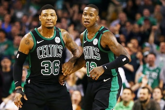 BOSTON, MA - MARCH 11:  Terry Rozier #12 and Marcus Smart #36 of the Boston Celtics react after a three-point shot during a game against the Indiana Pacers at TD Garden on March 11, 2018 in Boston, Massachusetts. NOTE TO USER: User expressly acknowledges 