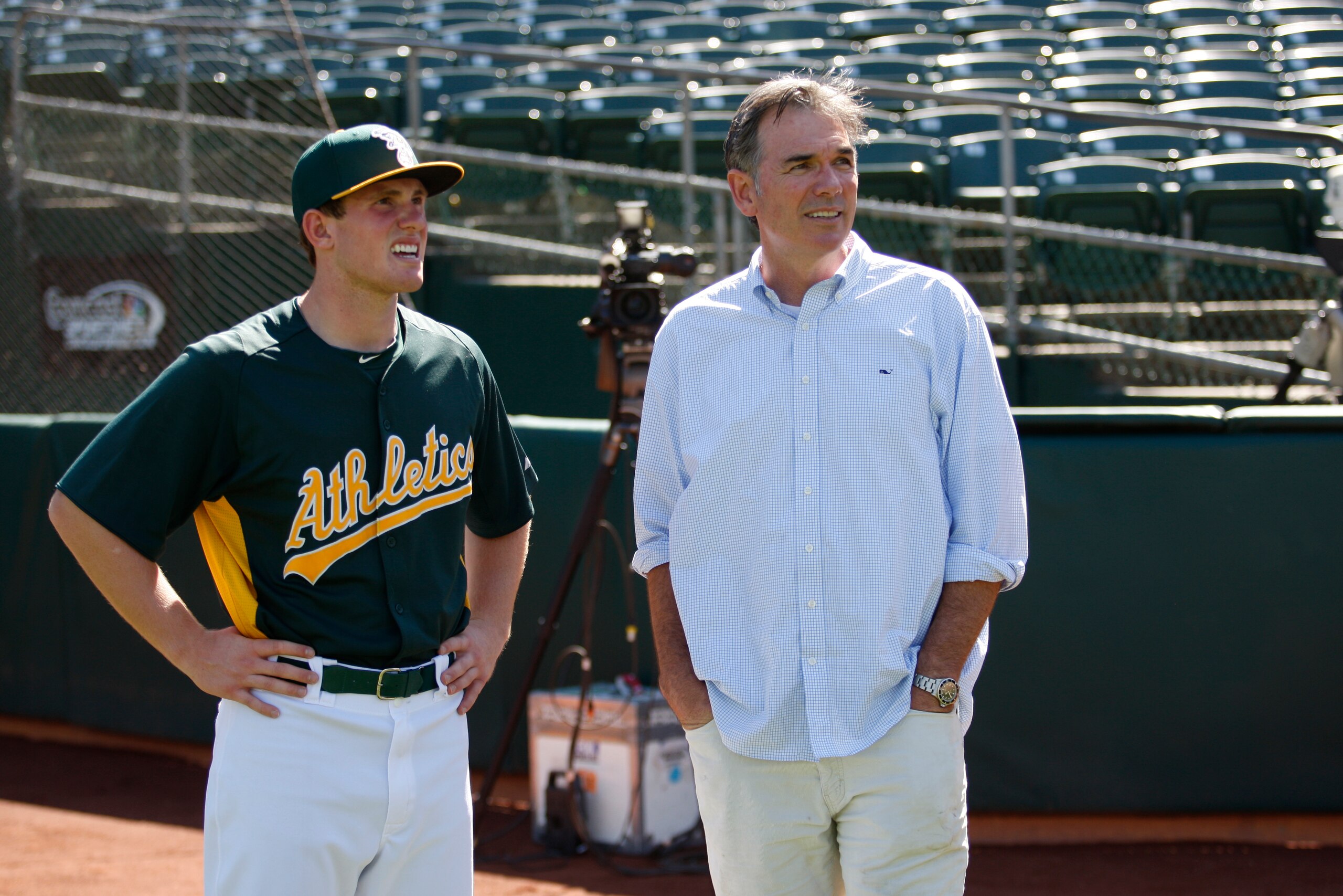 OAKLAND, CA - JUNE 14: General Manager Billy Beane of Oakland Athletics talks with the team first round draft pick Billy McKinney during a workout prior to the game against the Seattle Mariners at O.co Coliseum on June 14, 2013 in Oakland, California. The