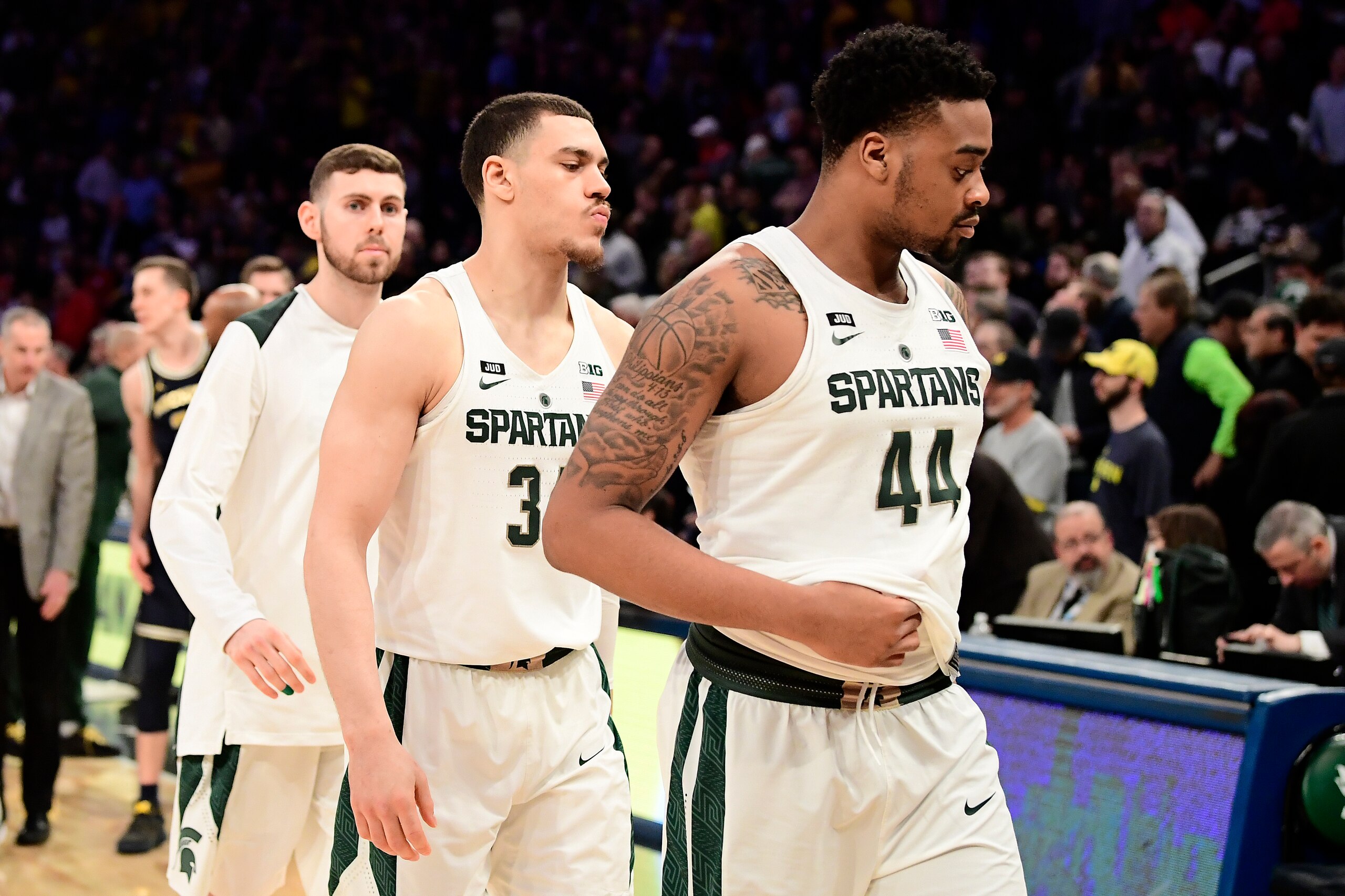 NEW YORK, NY - MARCH 03: Gavin Schilling #34 and Nick Ward #44 of the Michigan State Spartans walk off the court after their teams loss to the Michigan Wolverines during the semifinals of the Big Ten Basketball Tournament at Madison Square Garden on March