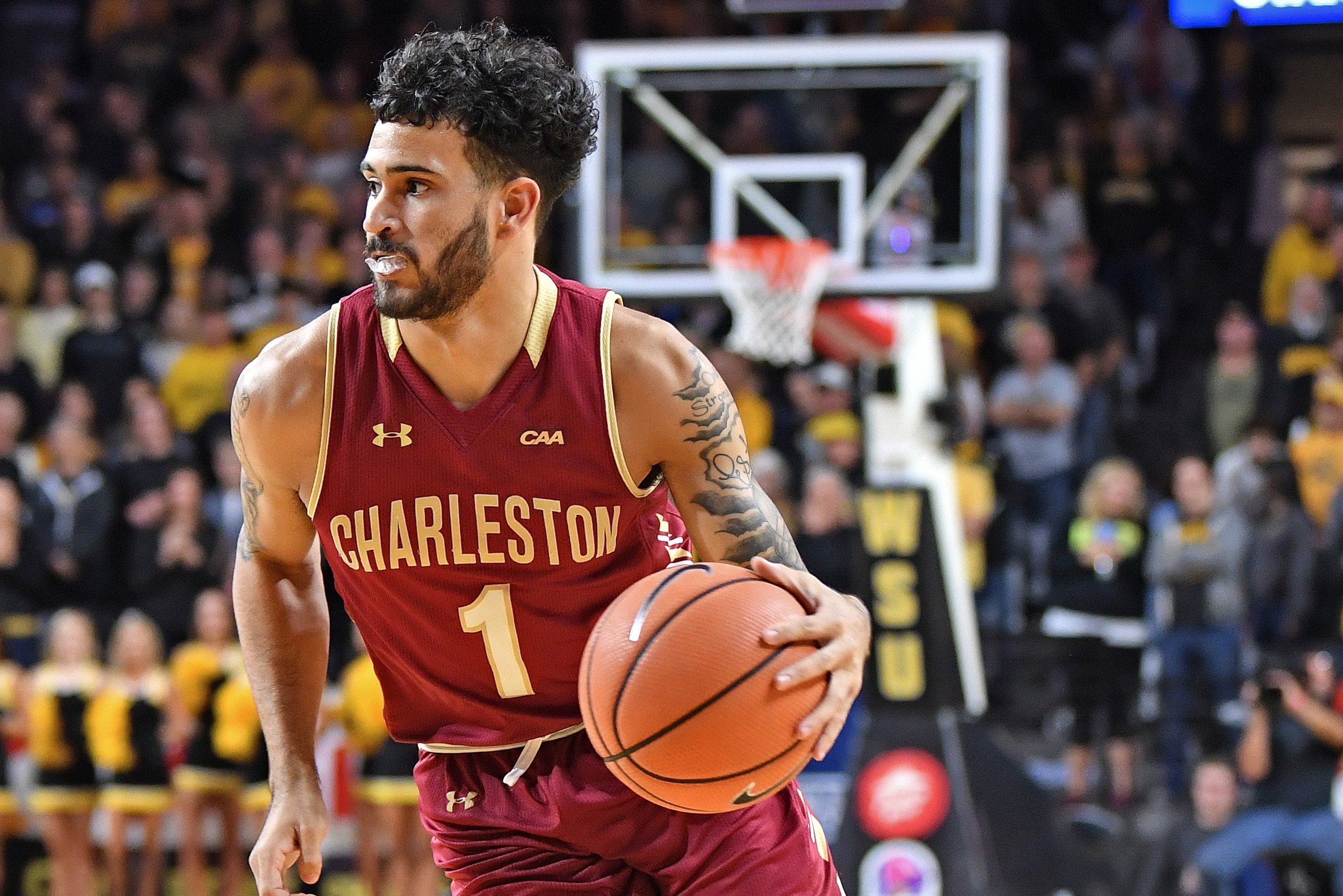 WICHITA, KS - NOVEMBER 13: Guard Grant Riller #1 of the College of Charleston Cougars dribbles the ball up court against the Wichita State Shockers during the second half on November 13, 2017 at Charles Koch Arena in Wichita, Kansas. (Photo by Peter G. WICHITA, KS - NOVEMBER 13: Guard Grant Riller #1 of the College of Charleston Cougars dribbles the ball up court against the Wichita State Shockers during the second half on November 13, 2017 at Charles Koch Arena in Wichita, Kansas. (Photo by Peter G.