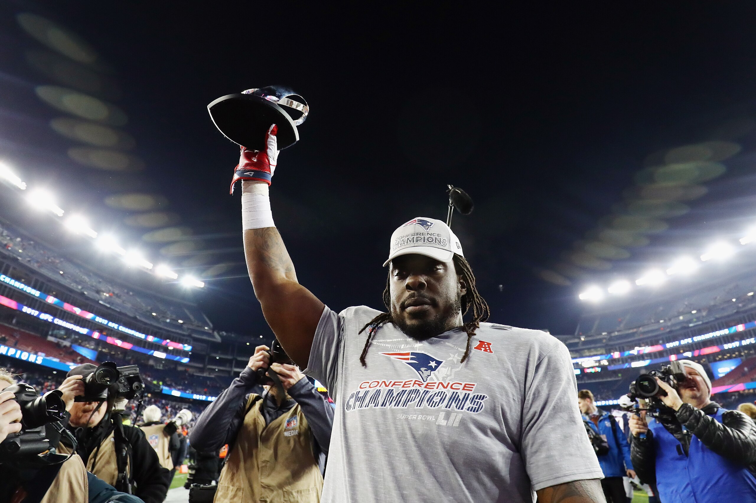 FOXBOROUGH, MA - JANUARY 21:  Ricky Jean Francois #94 of the New England Patriots celebrates with the Lamar Hunt trophy after winning the AFC Championship Game against the Jacksonville Jaguars at Gillette Stadium on January 21, 2018 in Foxborough, Massach