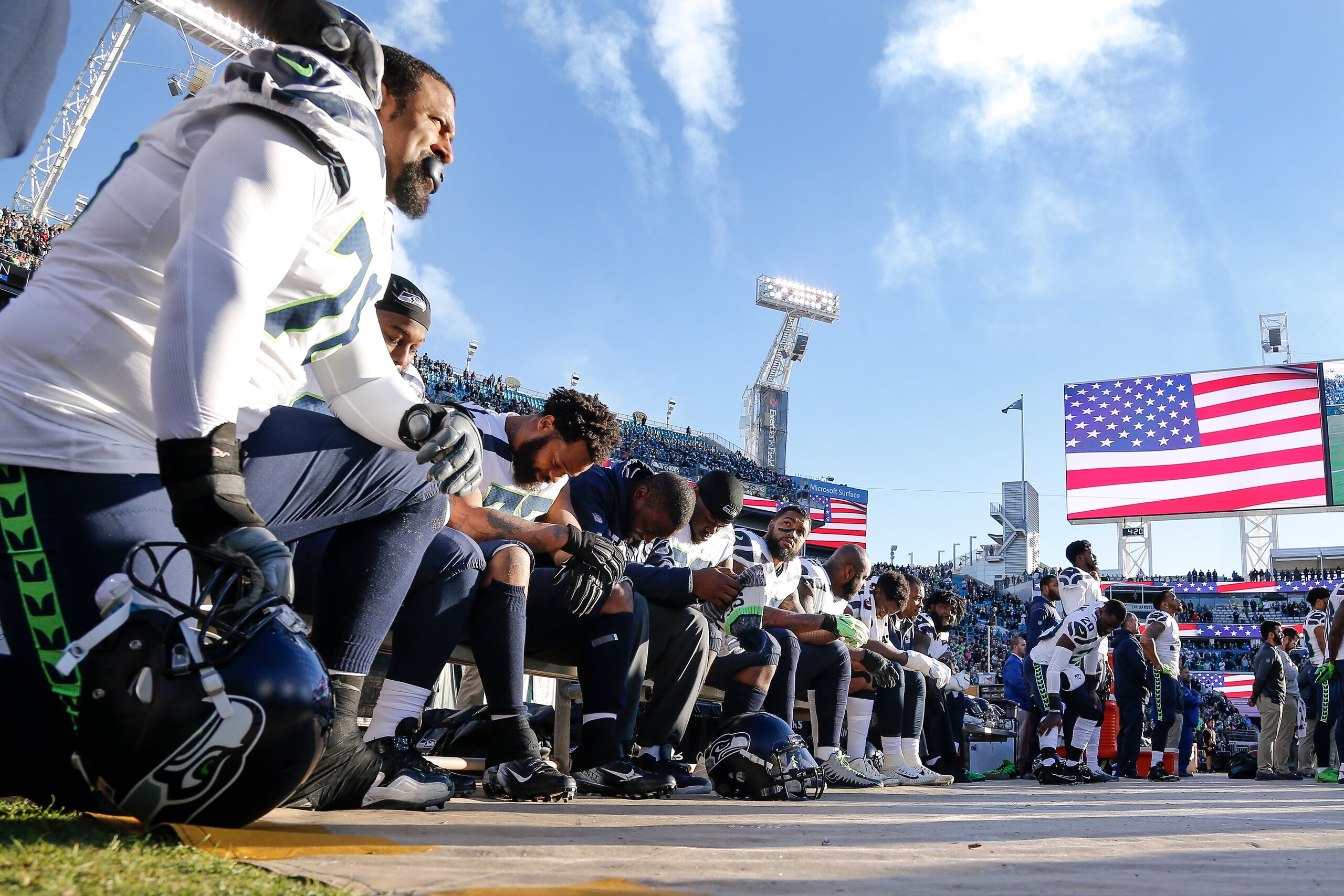 JACKSONVILLE, FL - DECEMBER 10: A general view of some of the Seattle Seahawks as they sit on their sidelines during the National Anthem before the game against the Jacksonville Jaguars at EverBank Field on December 10, 2017 in Jacksonville, Florida. The 