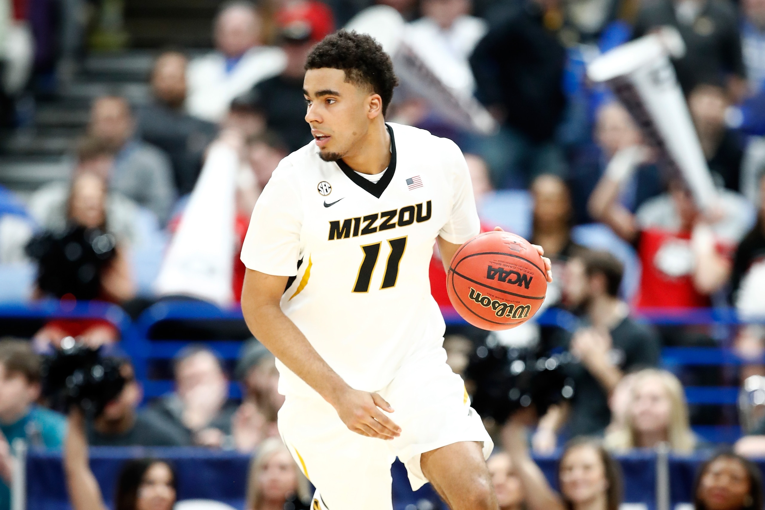 ST LOUIS, MO - MARCH 08:  Jontay Porter #11 of the Missouri Tigers dribbles the ball against the Georgia Bulldogs during the second round of the 2018 SEC Basketball Tournament at Scottrade Center on March 8, 2018 in St Louis, Missouri.  (Photo by Andy Lyo