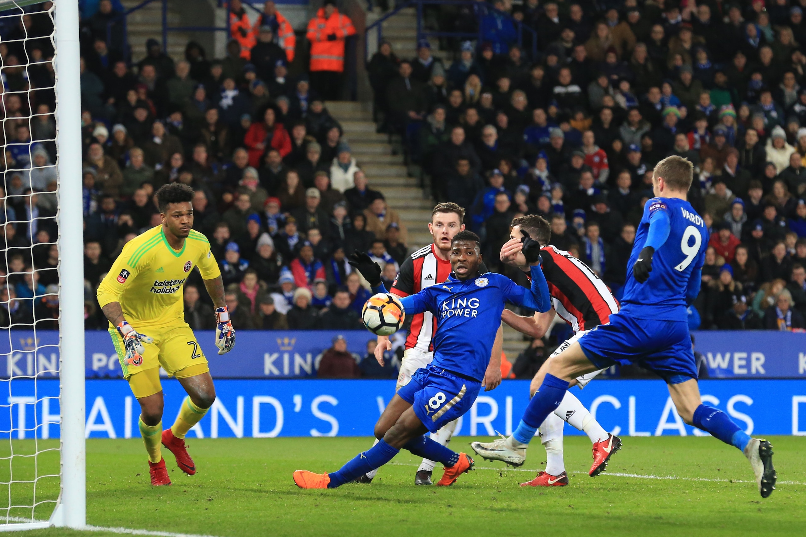 Leicester City's Nigerian striker Kelechi Iheanacho (C) passes to Leicester City's English striker Jamie Vardy who fails to score during the English FA Cup fifth round football match between Leicester City and Sheffield United at King Power Stadium in Lei