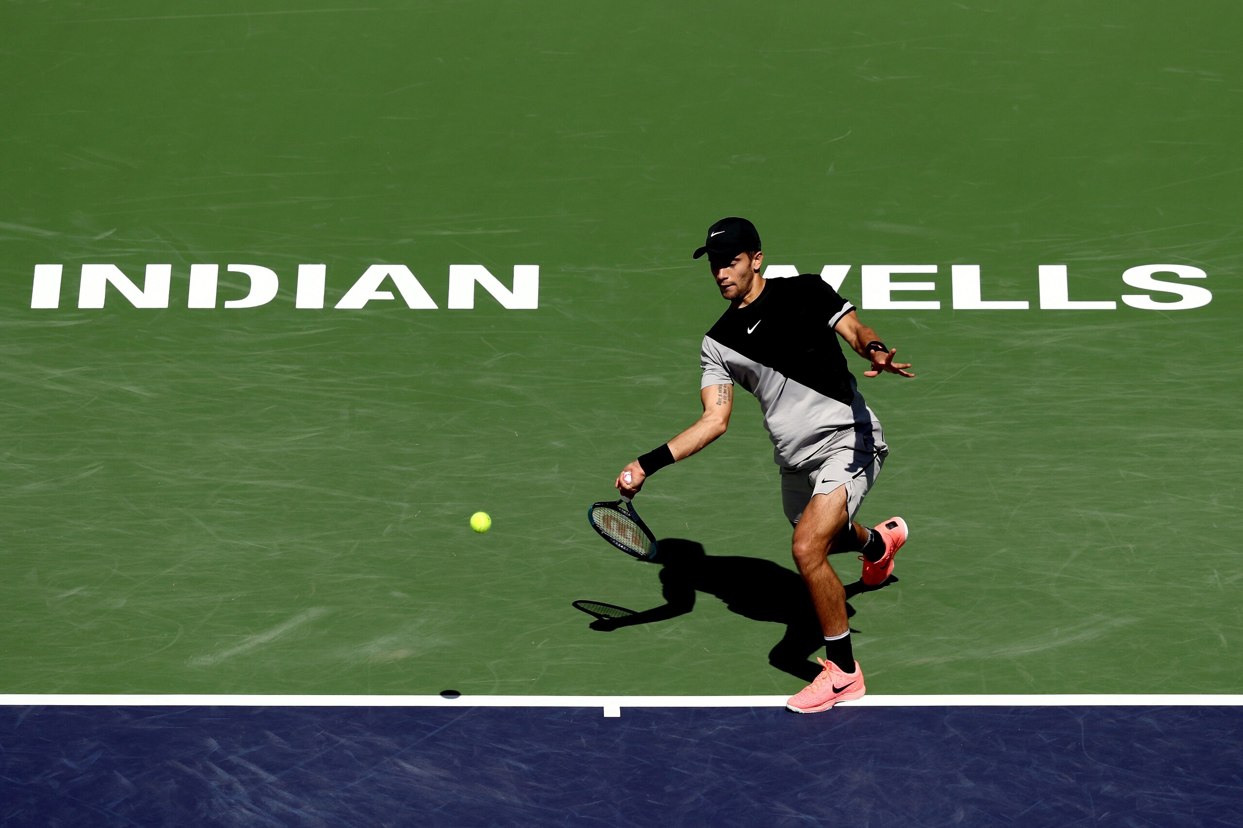 INDIAN WELLS, CA - MARCH 14:  Borna Coric of Croatia returns a shot to Taylor Fritz serves during the BNP Paribas Open at the Indian Wells Tennis Garden on March 14, 2018 in Indian Wells, California.  (Photo by Matthew Stockman/Getty Images)