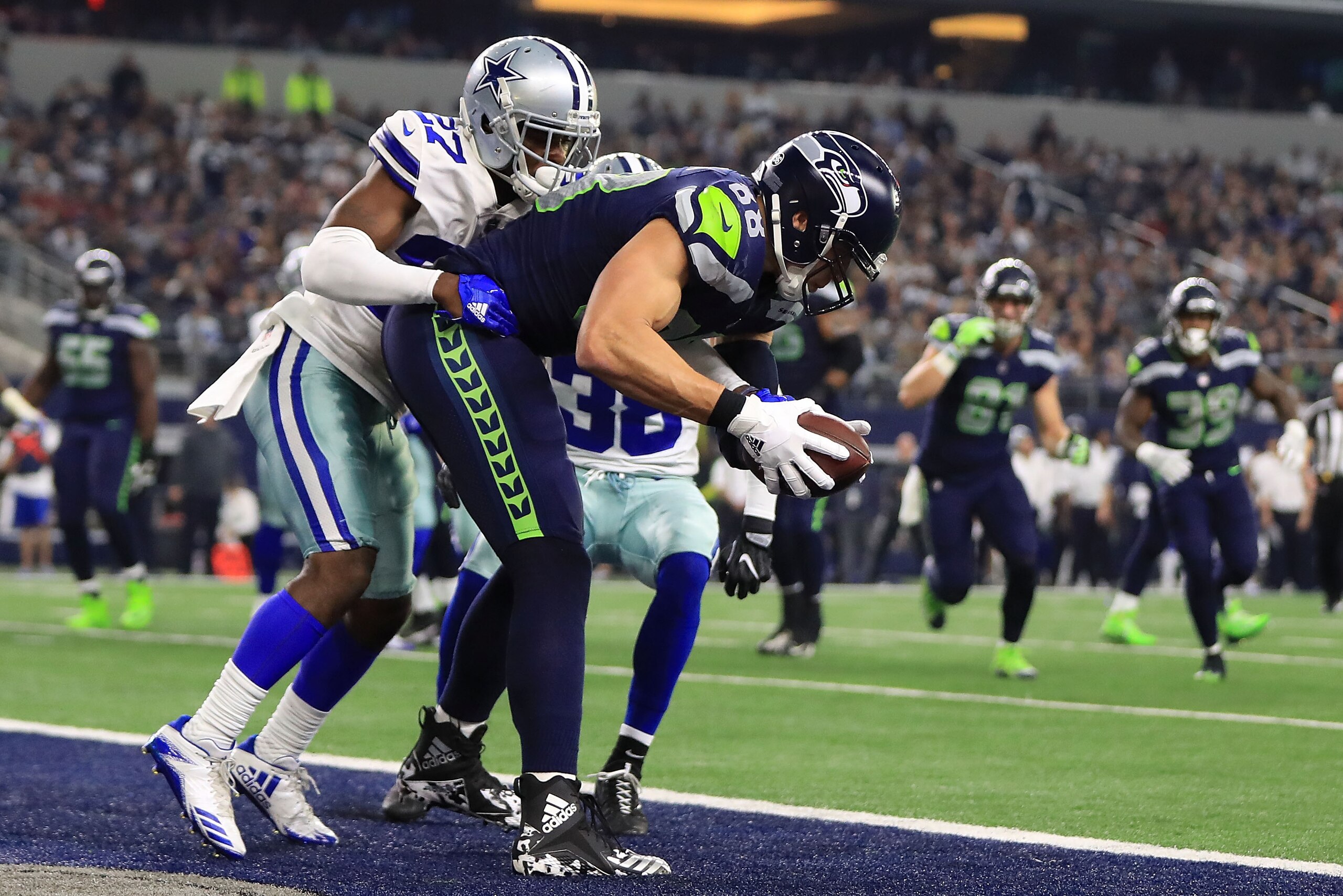 ARLINGTON, TX - DECEMBER 24:  Jimmy Graham #88 of the Seattle Seahawks pulls in a touchdown against Jourdan Lewis #27 of the Dallas Cowboys and Jeff Heath #38 of the Dallas Cowboys at AT&T Stadium on December 24, 2017 in Arlington, Texas.  (Photo by Ronal