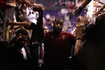 PHOENIX, AZ - MARCH 13:  LeBron James #23 of the Cleveland Cavaliers high fives fans following the NBA game against the Phoenix Suns at Talking Stick Resort Arena on March 13, 2018 in Phoenix, Arizona. The Cavaliers defeated the Suns 129-107. NOTE TO USER