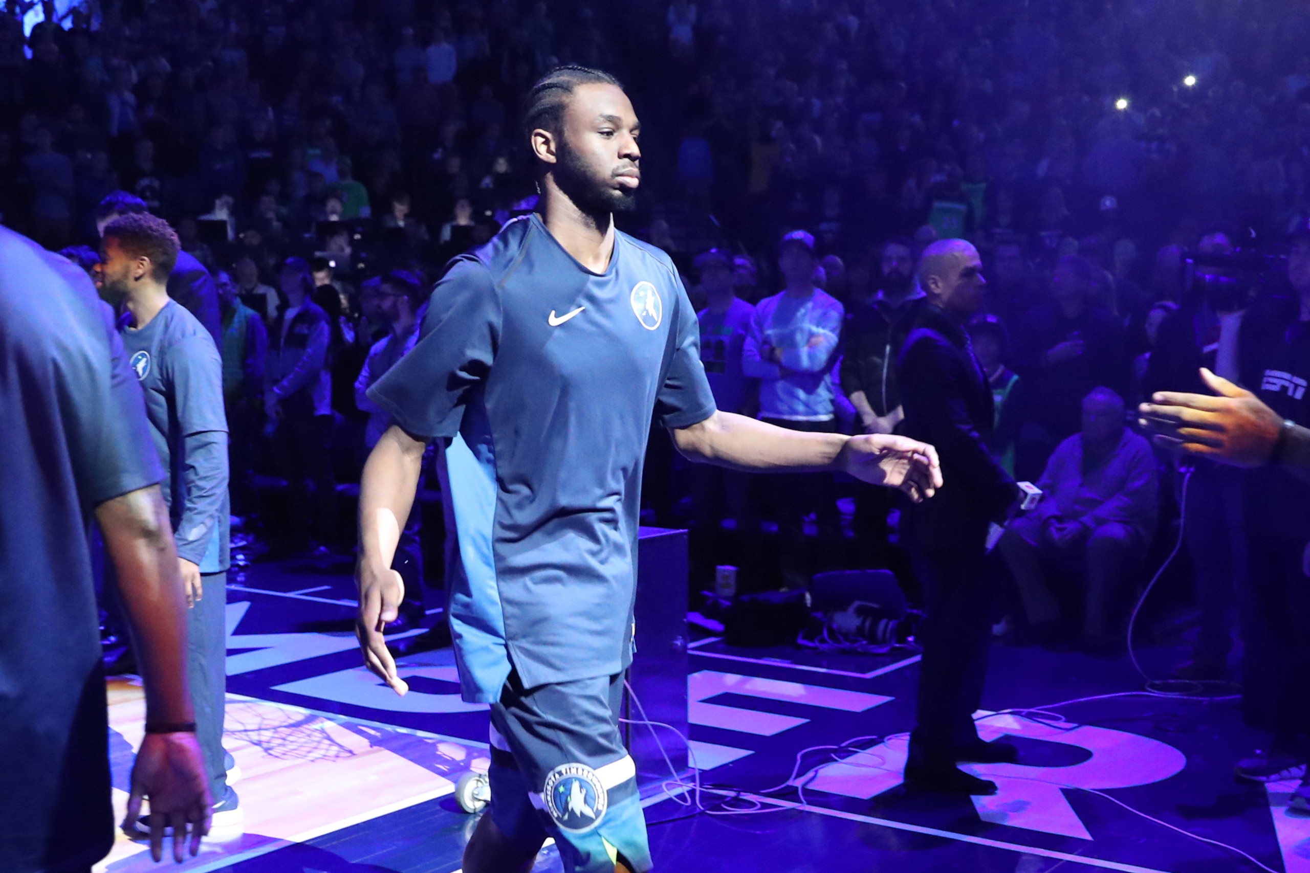 MINNEAPOLIS, MN - MARCH 11: Andrew Wiggins #22 of the Minnesota Timberwolves makes his entrance before the game against the Golden State Warriors on March 11, 2018 at Target Center in Minneapolis, Minnesota. NOTE TO USER: User expressly acknowledges and a