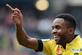 Sochaux' French forward Cedric Bakambu celebrates after scoring a goal during the French L1 football match Sochaux (FCSM) vs AS Monaco (ASM) on October 20, 2013 at the Auguste Bonal stadium in Montbeliard, eastern France.      AFP PHOTO/PATRICK HERTZOG   