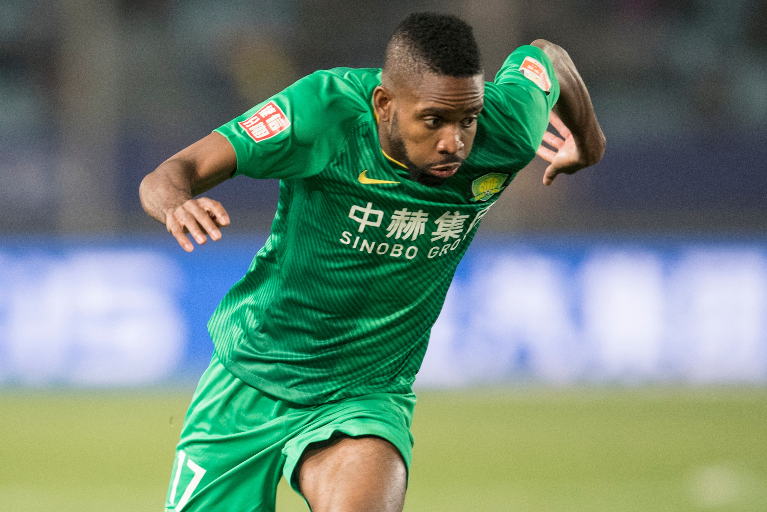 NANJING, CHINA - MARCH 11:  Cedric Bakambu #7 of Beijing Guoan FC in action during the 2018 Chinese Super League match between Jiangsu Suning and Beijing Guoan at Nanjing Olympic Sports Center on March 11, 2018 in Nanjing, China.  (Photo by XIN LI/Getty I
