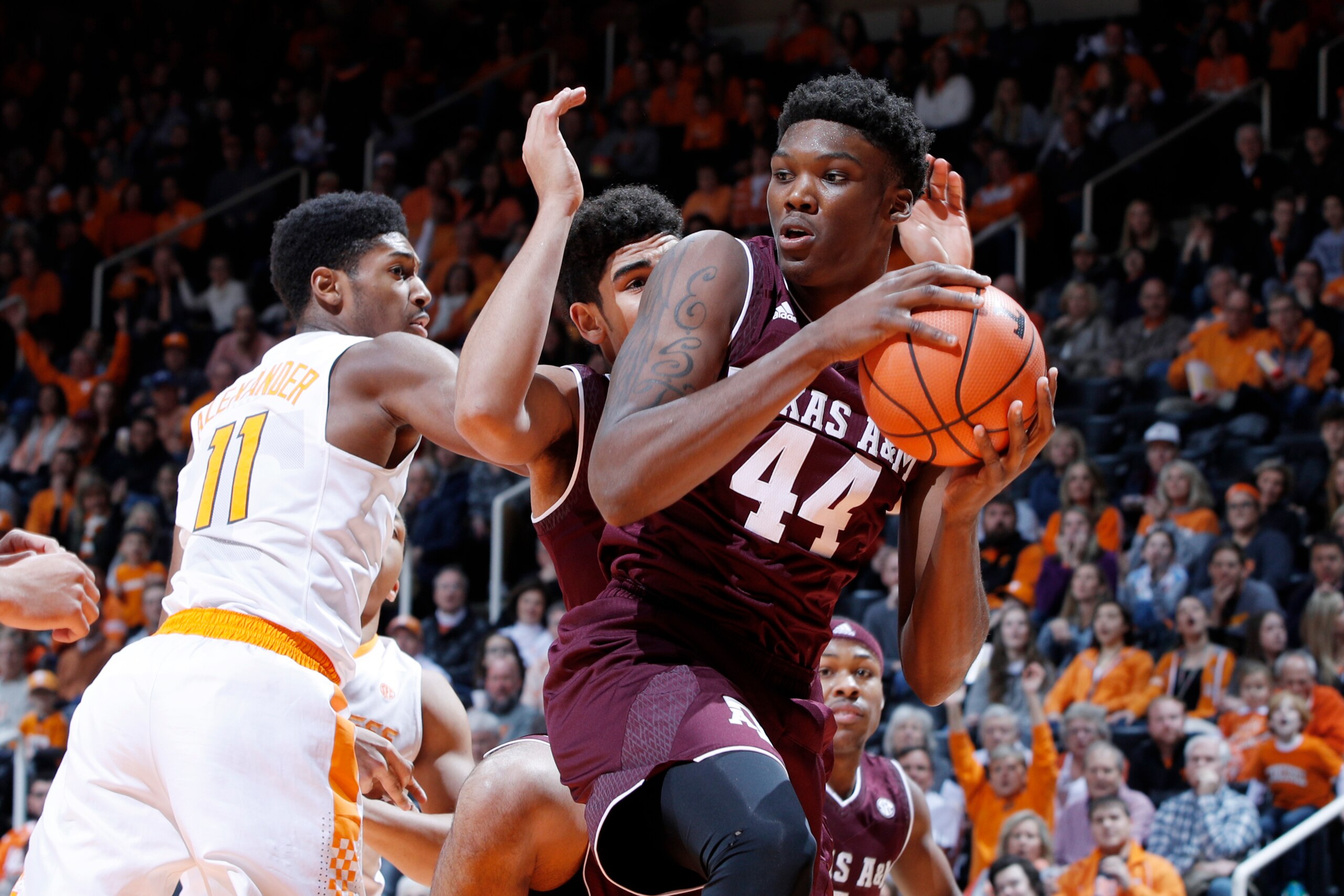 KNOXVILLE, TN - JANUARY 13: Robert Williams #44 of the Texas A&M Aggies rebounds against Kyle Alexander #11 of the Tennessee Volunteers in the first half of a game at Thompson-Boling Arena on January 13, 2018 in Knoxville, Tennessee. Tennessee won 75-62. 