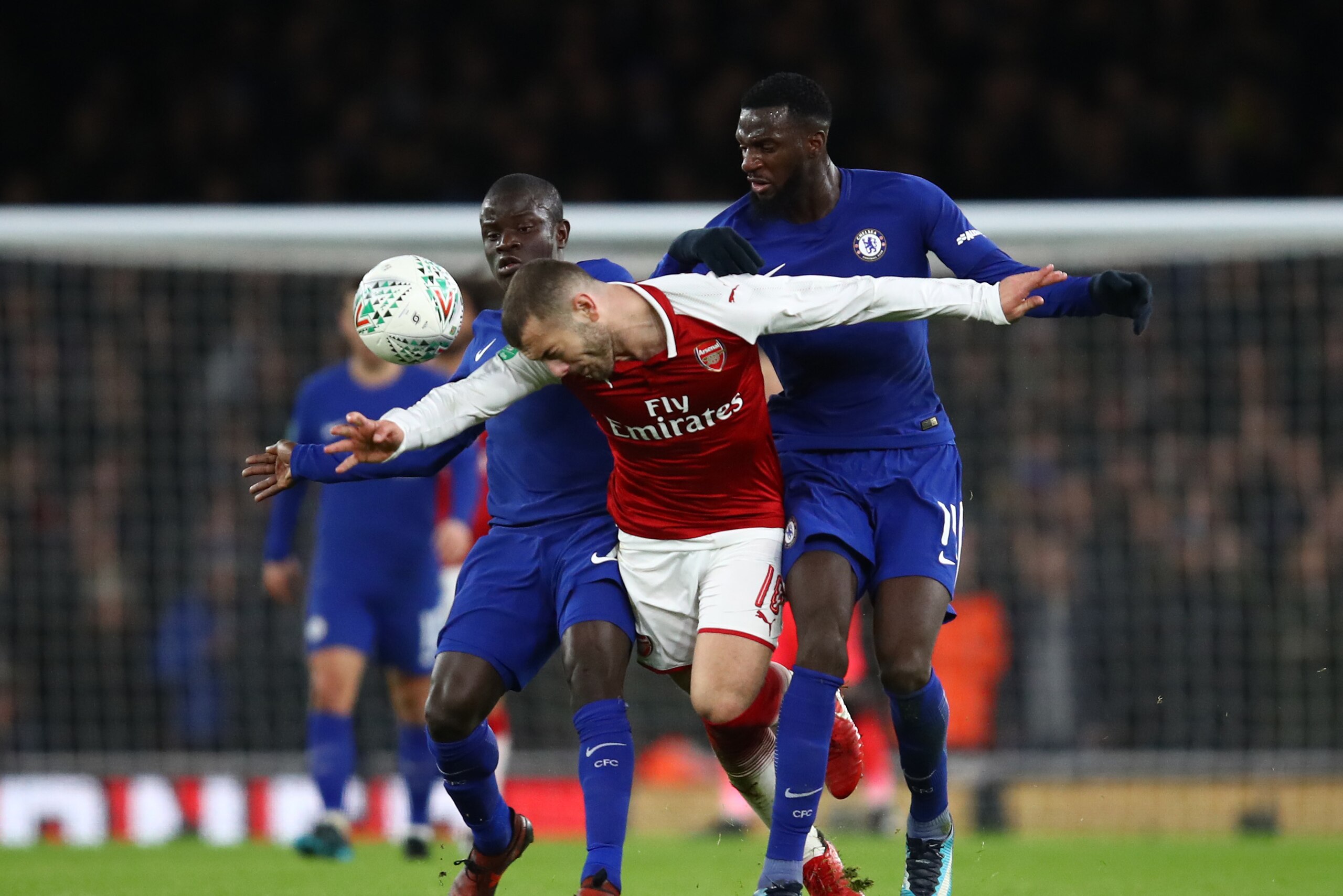 LONDON, ENGLAND - JANUARY 24: Jack Wilshere of Arsenal is tackled by Tiemoue Bakayoko of Chelsea amd N'Golo Kante during the Carabao Cup Semi-Final Second Leg at Emirates Stadium on January 24, 2018 in London, England. (Photo by Julian Finney/Getty Ima LONDON, ENGLAND - JANUARY 24: Jack Wilshere of Arsenal is tackled by Tiemoue Bakayoko of Chelsea amd N'Golo Kante during the Carabao Cup Semi-Final Second Leg at Emirates Stadium on January 24, 2018 in London, England. (Photo by Julian Finney/Getty Ima