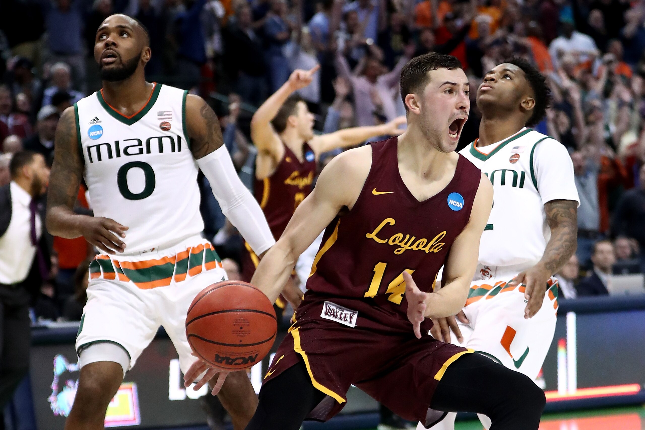 DALLAS, TX - MARCH 15: Ben Richardson #14 celebrates after Donte Ingram #0 of the Loyola Ramblers makes his game-winning three pointer against the Miami Hurricanes in the first round of the 2018 NCAA Men's Basketball Tournament at American Airlines Cent DALLAS, TX - MARCH 15: Ben Richardson #14 celebrates after Donte Ingram #0 of the Loyola Ramblers makes his game-winning three pointer against the Miami Hurricanes in the first round of the 2018 NCAA Men's Basketball Tournament at American Airlines Cent