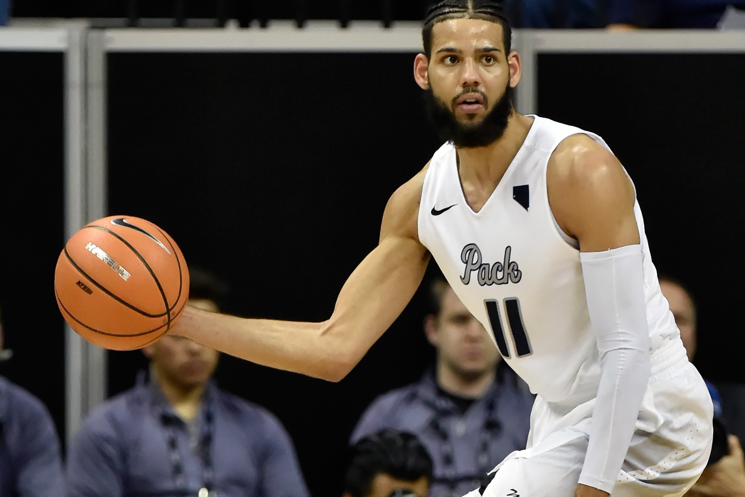 LAS VEGAS, NV - MARCH 09:  Cody Martin #11 of the Nevada Wolf Pack brings the ball up court during a semifinal game of the Mountain West Conference basketball tournament against the San Diego State Aztecs at the Thomas & Mack Center on March 9, 2018 in La