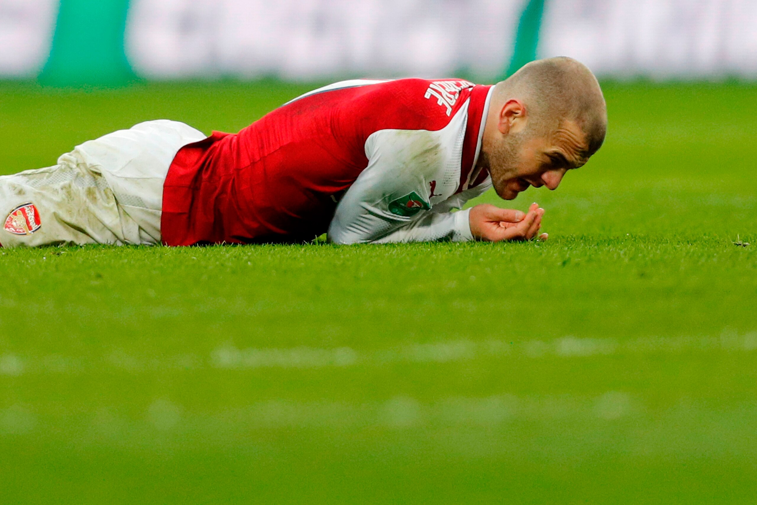 Arsenal's English midfielder Jack Wilshere reacts after picking up an injury during the English League Cup final football match between Manchester City and Arsenal at Wembley stadium in north London on February 25, 2018. / AFP PHOTO / Adrian DENNIS / REST Arsenal's English midfielder Jack Wilshere reacts after picking up an injury during the English League Cup final football match between Manchester City and Arsenal at Wembley stadium in north London on February 25, 2018. / AFP PHOTO / Adrian DENNIS / REST