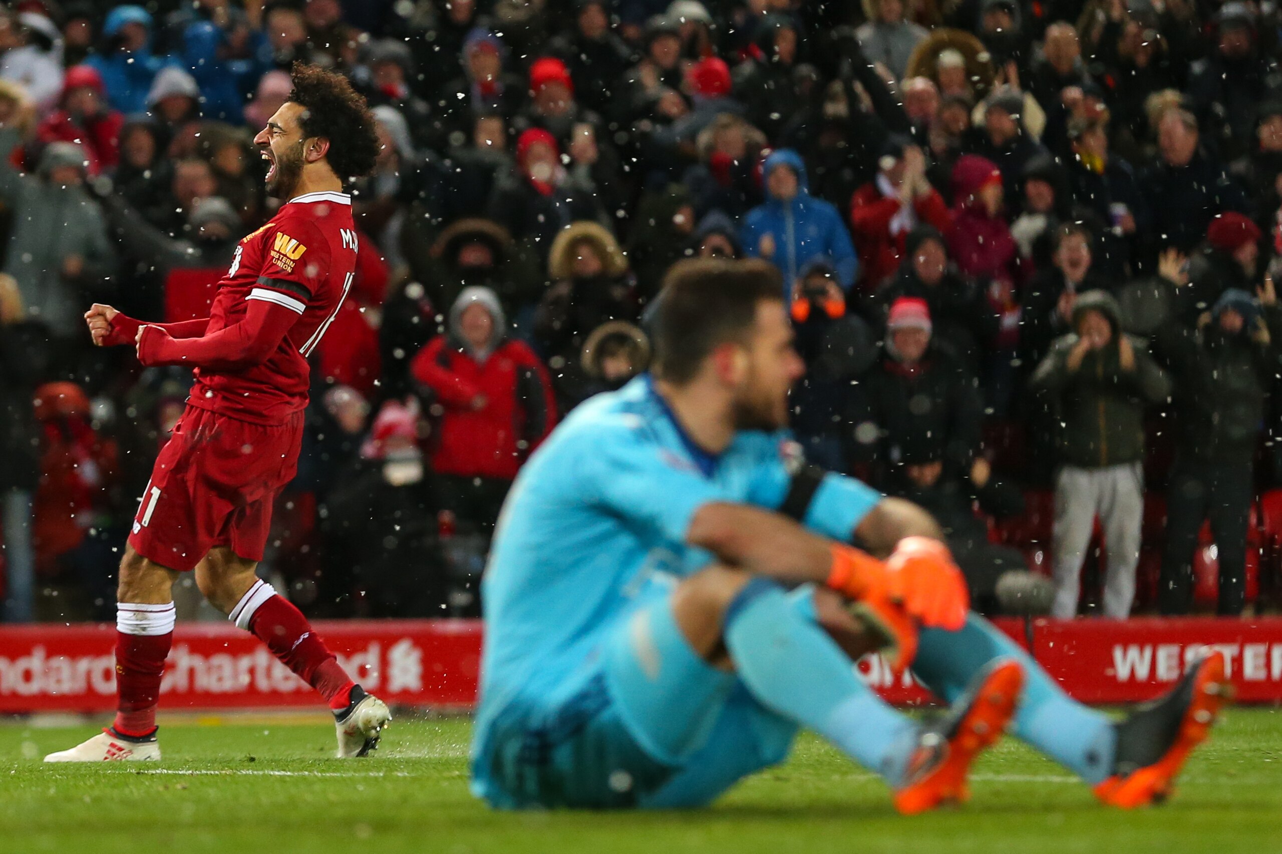 LIVERPOOL, ENGLAND - MARCH 17: Mohamed Salah of Liverpool celebrates after scoring a goal to make it 4-0 during the Premier League match between Liverpool and Watford at Anfield on March 17, 2018 in Liverpool, England. (Photo by Robbie Jay Barratt - AMA/G