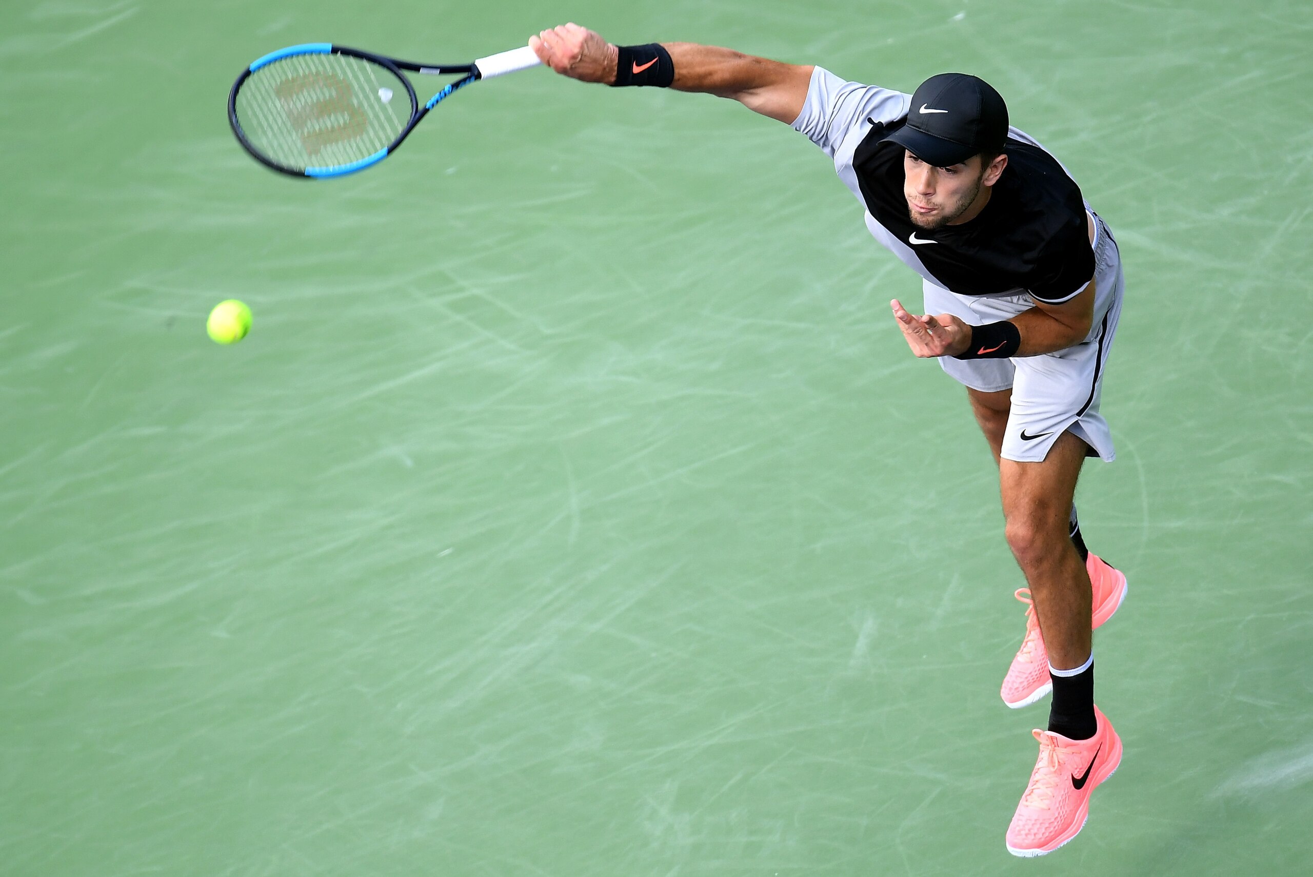 INDIAN WELLS, CA - MARCH 17:  Borna Coric of Croatia serves in his semifinal match against Roger Federer of Switzerland during the BNP Paribas Open at the Indian Wells Tennis Garden on March 17, 2018 in Indian Wells, California.  (Photo by Harry How/Getty