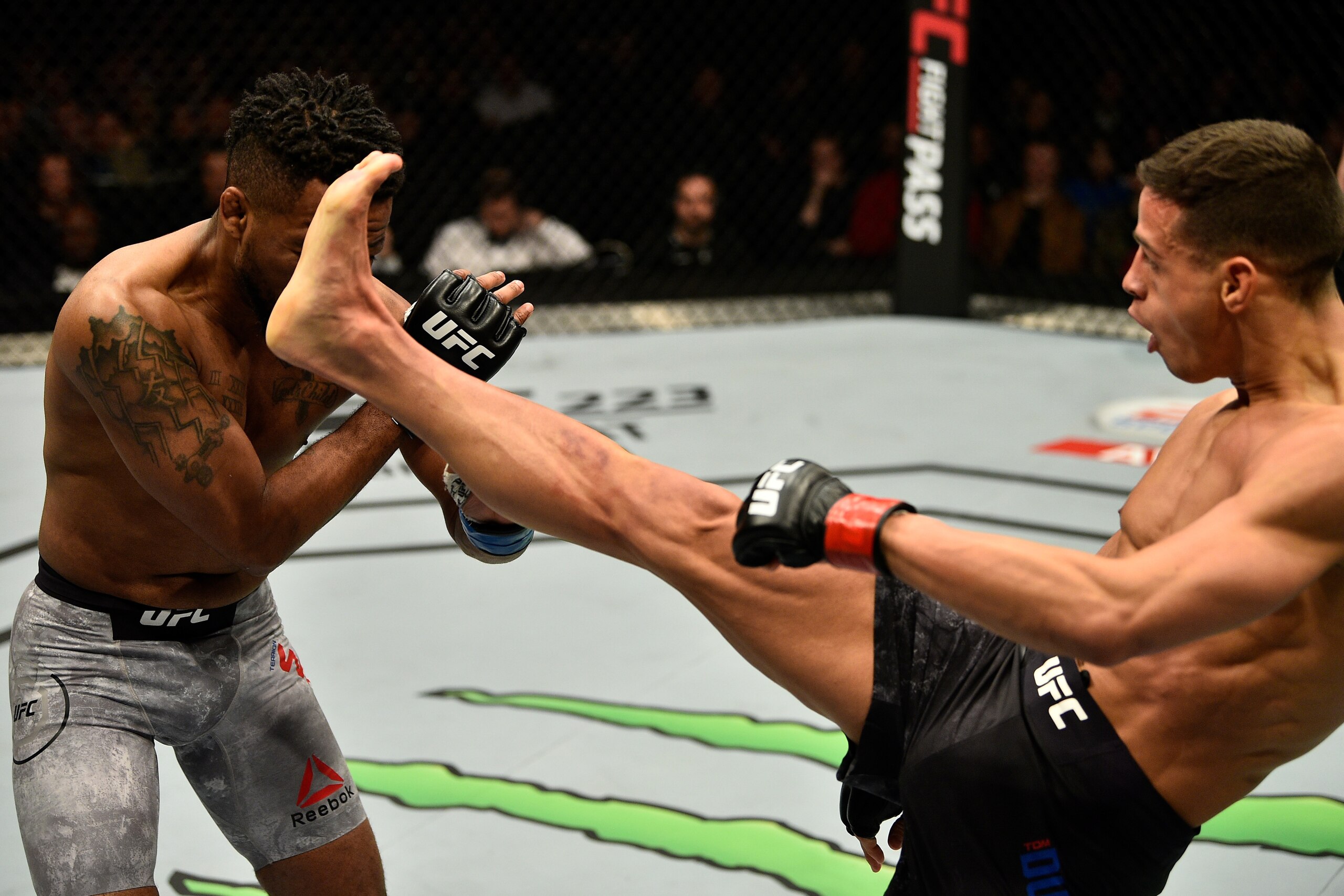 LONDON, ENGLAND - MARCH 17:  (R-L) Tom Duquesnoy of France kicks Terrion Ware in their bantamweight bout inside The O2 Arena on March 17, 2018 in London, England. (Photo by Brandon Magnus/Zuffa LLC/Zuffa LLC via Getty Images)
