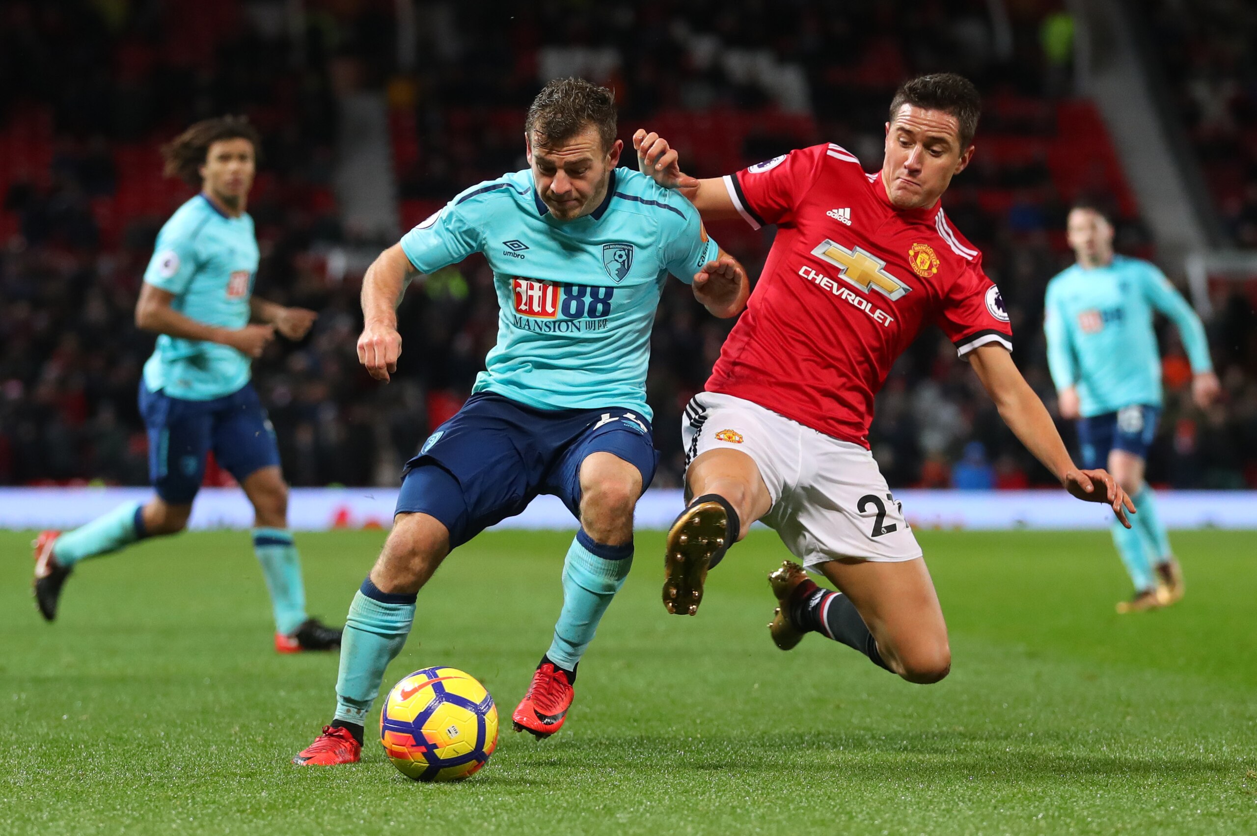 MANCHESTER, ENGLAND - DECEMBER 13: Ryan Fraser of AFC Bournemouth is tackled by Ander Herrera of Manchester United during the Premier League match between Manchester United and AFC Bournemouth at Old Trafford on December 13, 2017 in Manchester, England. (