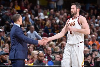 CLEVELAND, OH - JANUARY 26:  Tyronn Lue of the Cleveland Cavaliers high-fives Kevin Love #0 during the game against the Indiana Pacers on January 26, 2018 at Quicken Loans Arena in Cleveland, Ohio. NOTE TO USER: User expressly acknowledges and agrees that
