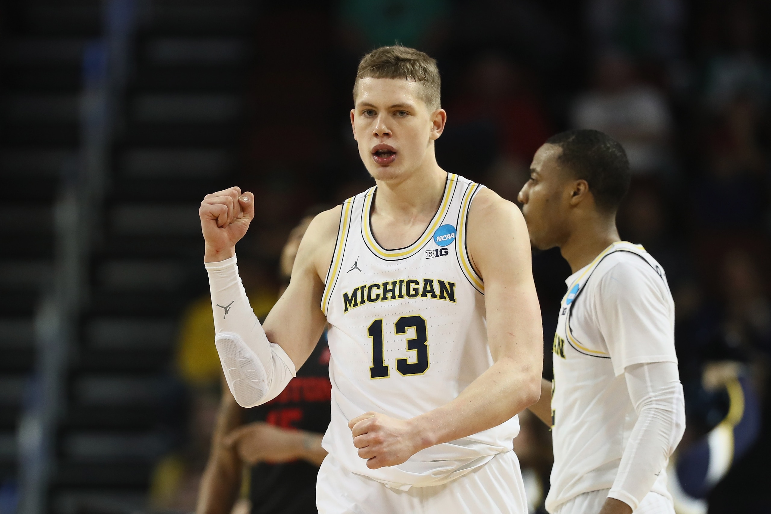 WICHITA, KS - MARCH 17: Moritz Wagner #13 of the Michigan Wolverines reacts against the Houston Cougars in the second half during the second round of the 2018 NCAA Men's Basketball Tournament at INTRUST Bank Arena on March 17, 2018 in Wichita, Kansas.  Th